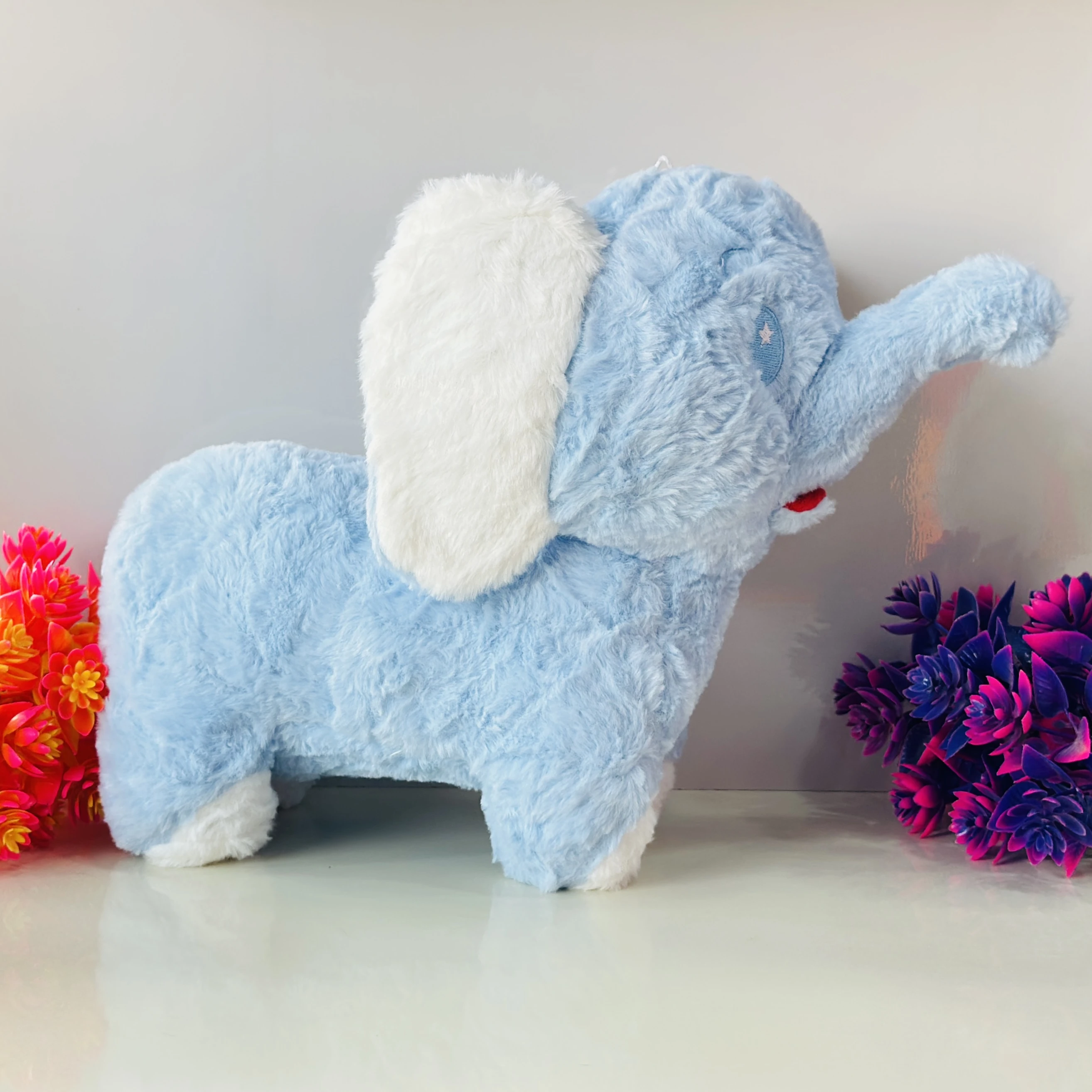 Soft blue elephant plush toy.