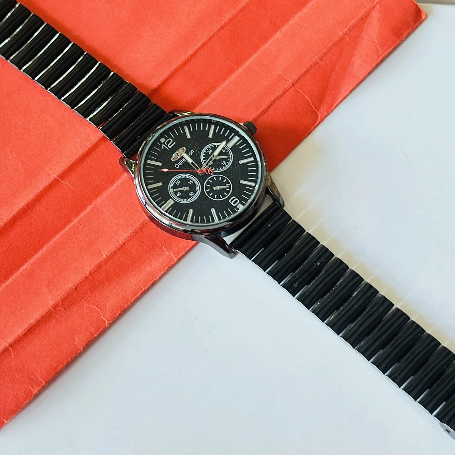 Foce men's chronograph watch with a black dial and a metal strap.