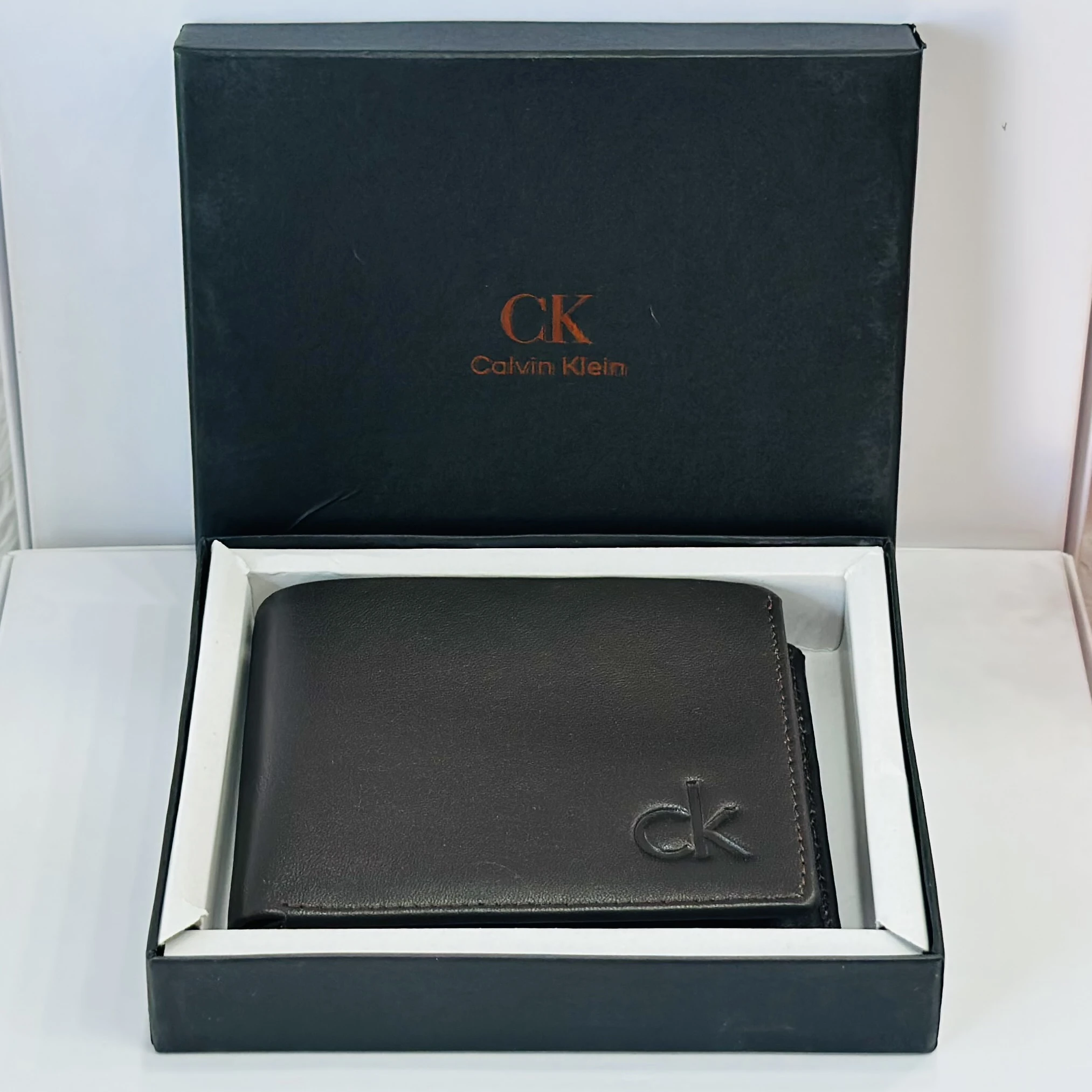 Calvin Klein men's bi-fold leather wallet in brown.