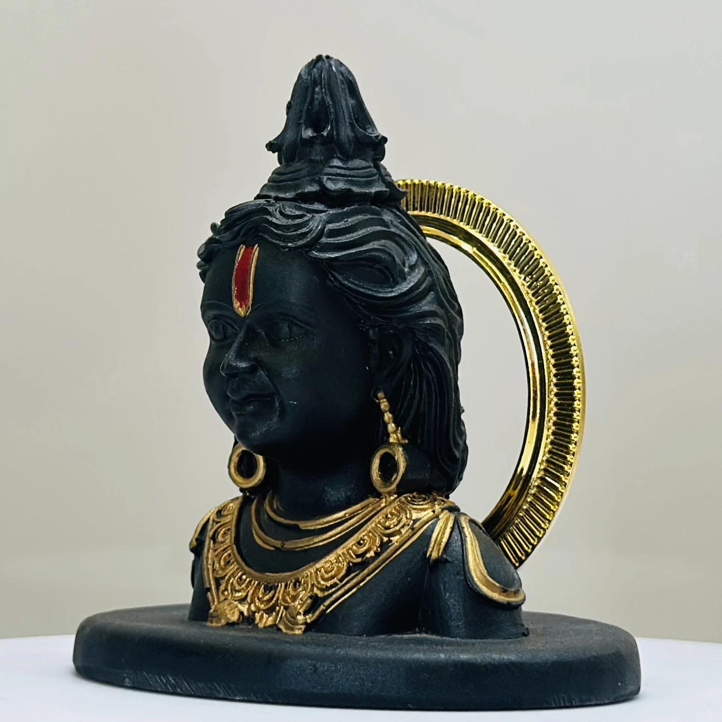 black resin idol of Ram Lalla (Lord Rama as a child).