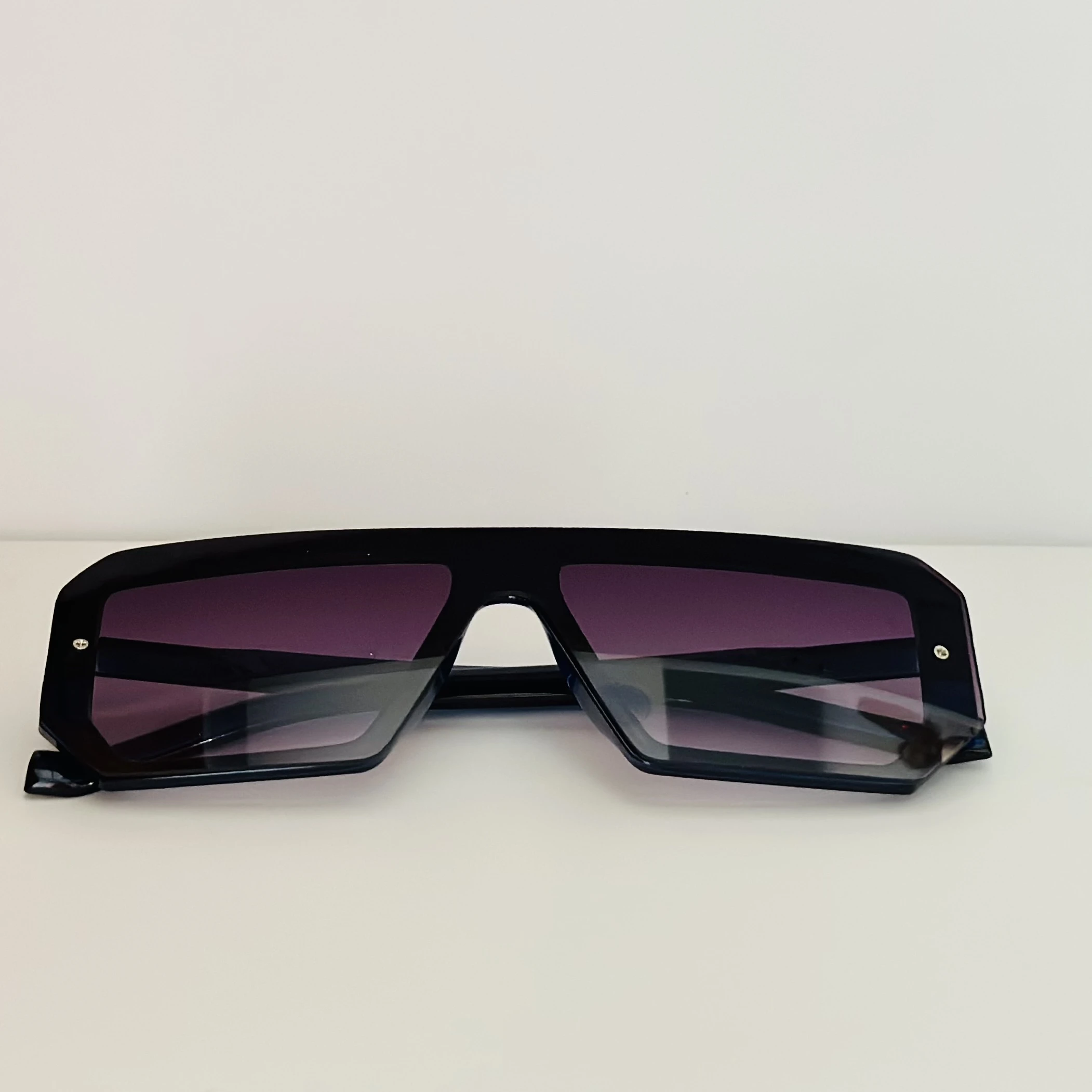 black polycarbonate oversized rectangular sunglasses.