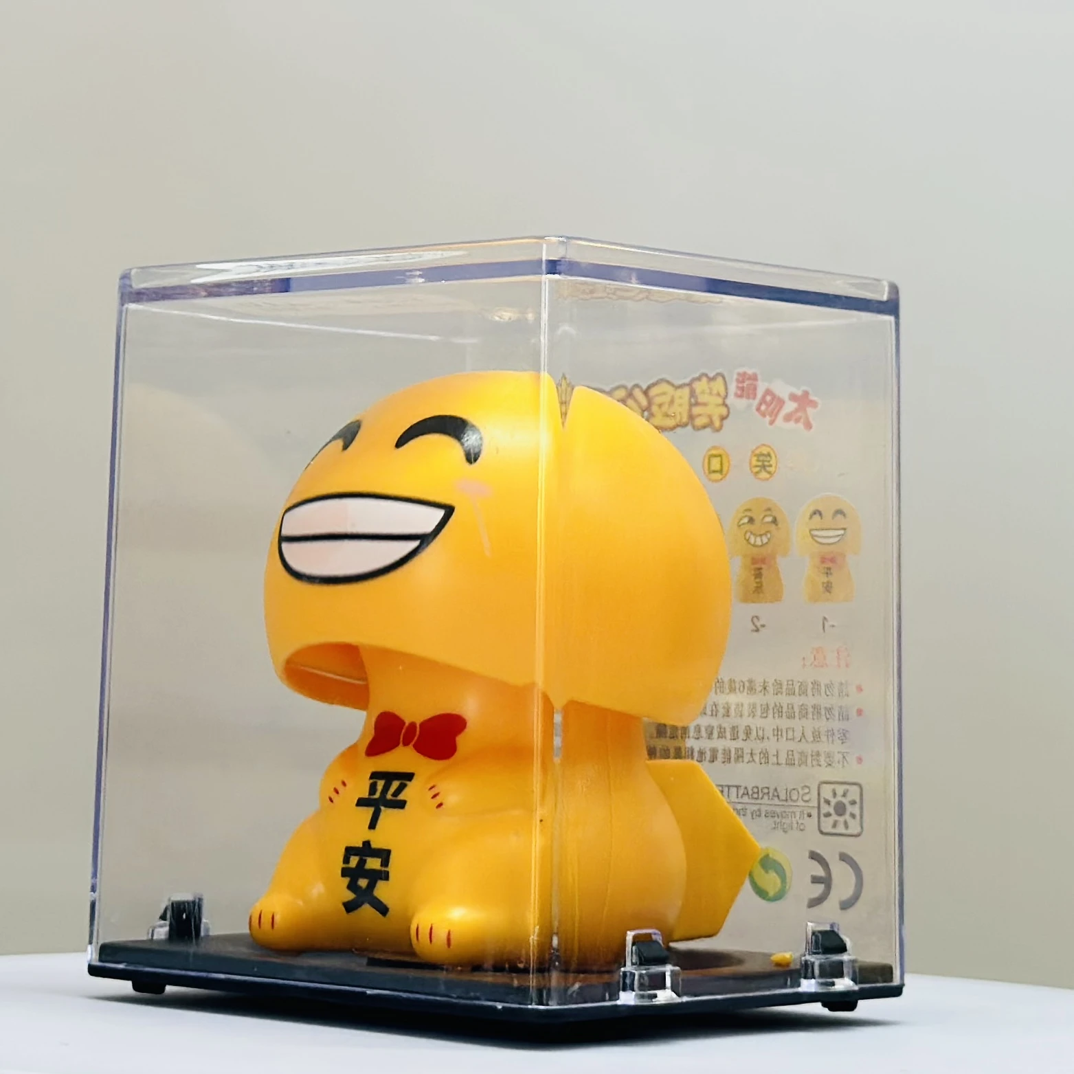 solar-powered smiley figurine