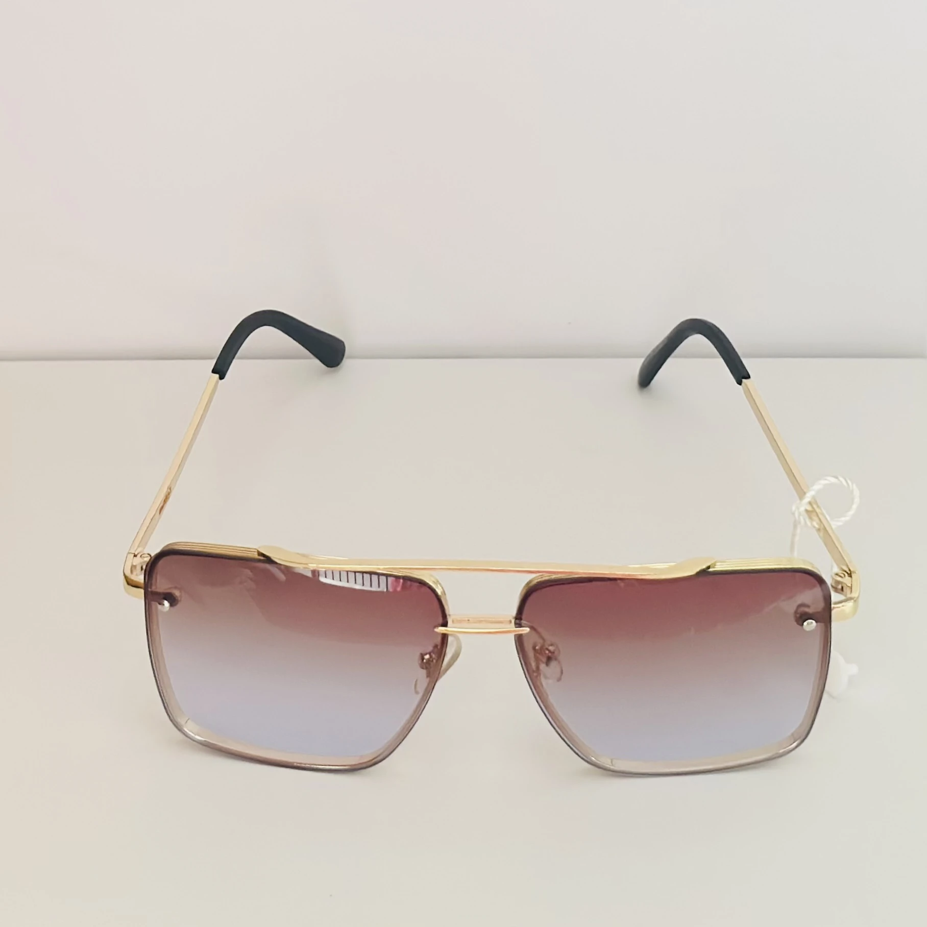 pair of DITA Mach-Six sunglasses with gold-tone frames and brown-to-clear gradient lenses