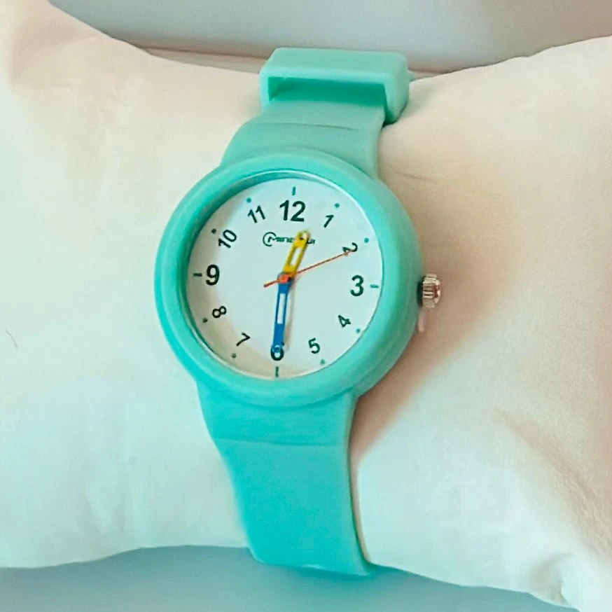 Mingrui analog quartz watch with a black silicone or plastic strap.