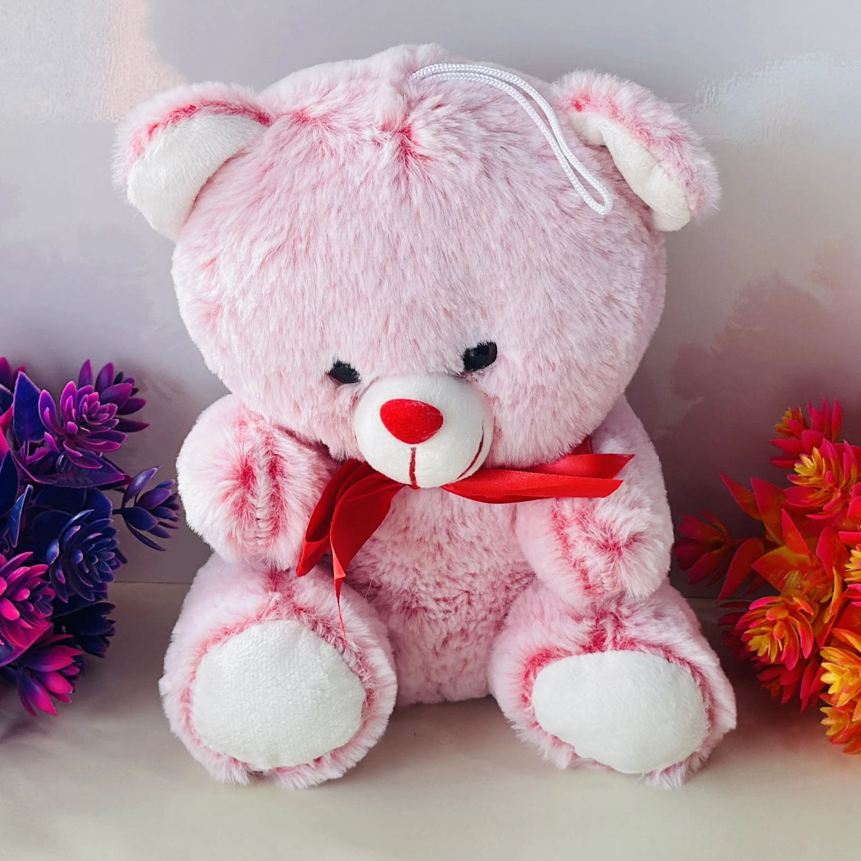 pink teddy bear soft toy.