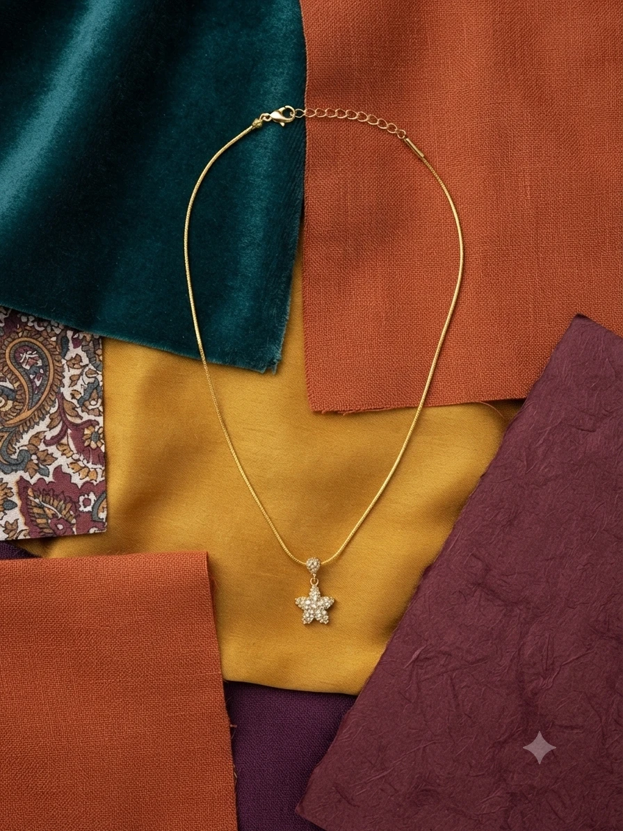 yellow gold chain with a star-shaped diamond pendant