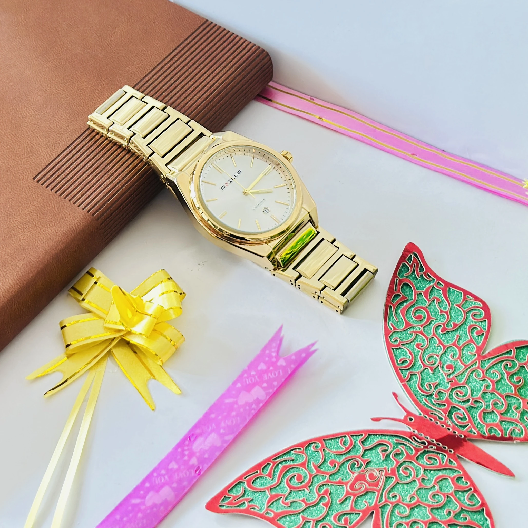 Gold colored metal strap watch