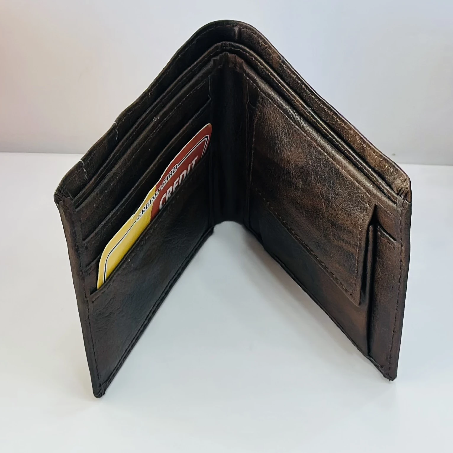 Brown bifold wallet from the brand Tommy.