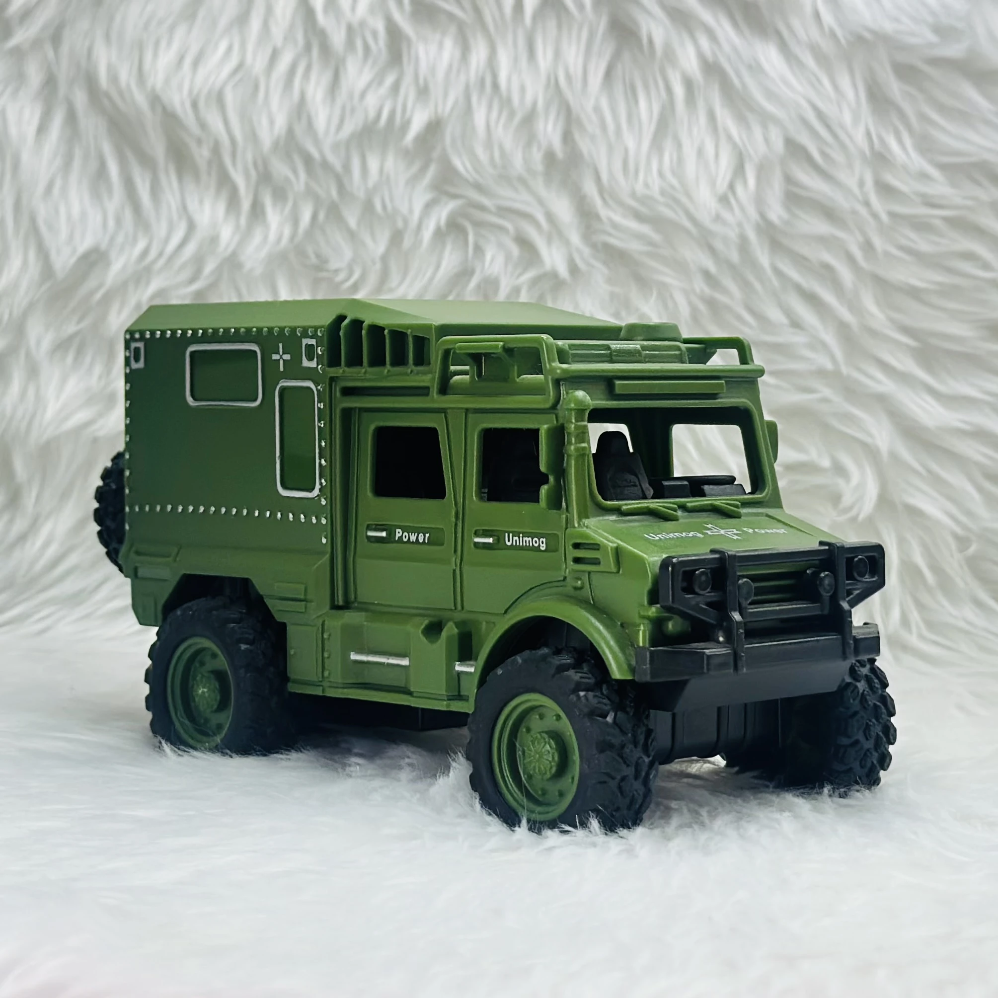 Toy Club Unimog army truck toy.