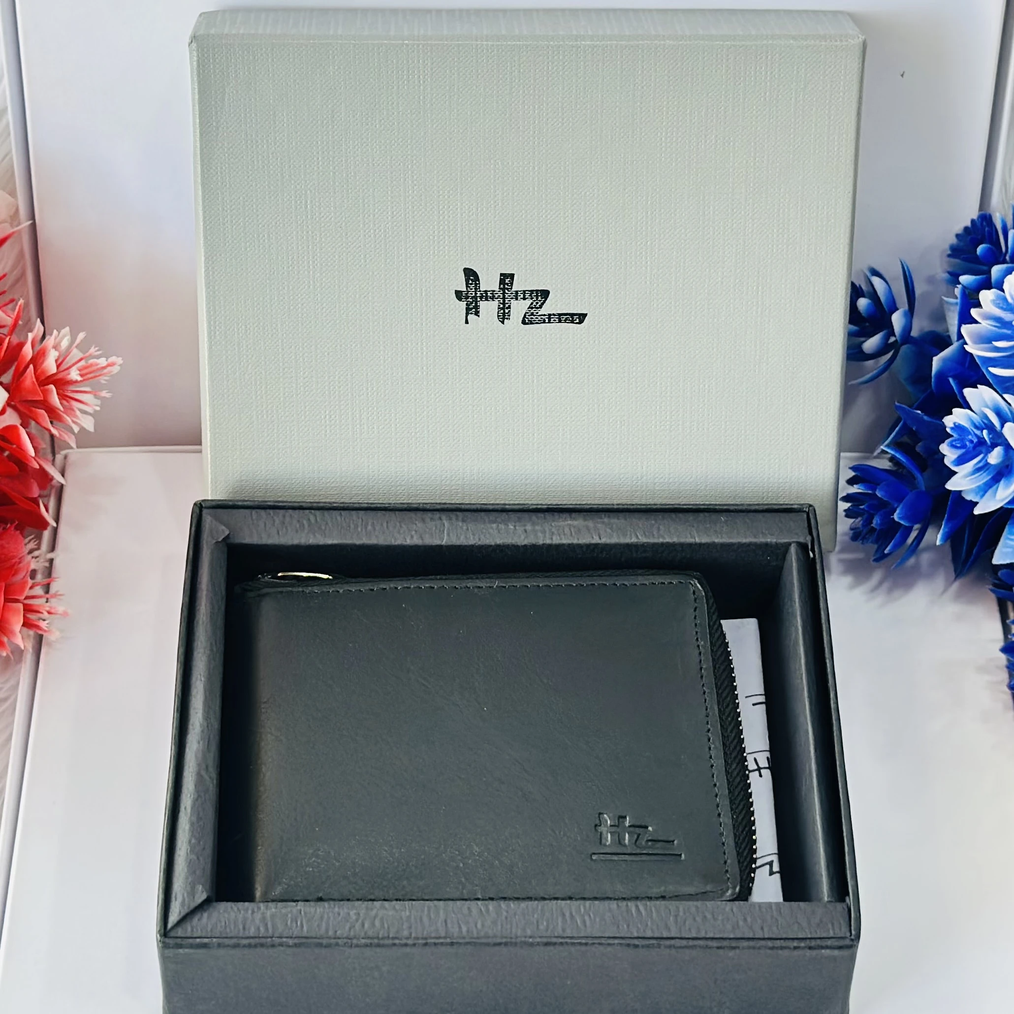Black HZ leather zip-around wallet for men.