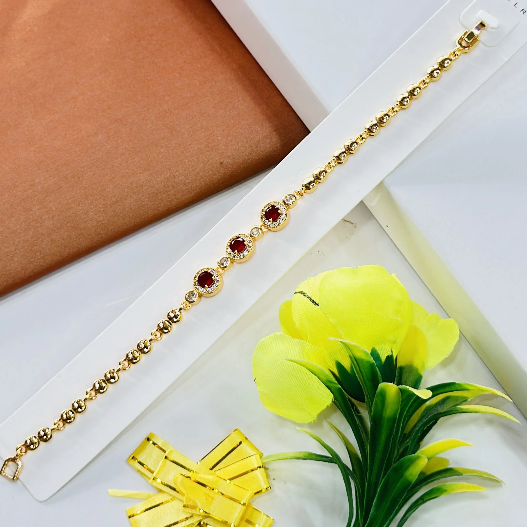 gold-plated bracelet decorated with red stones