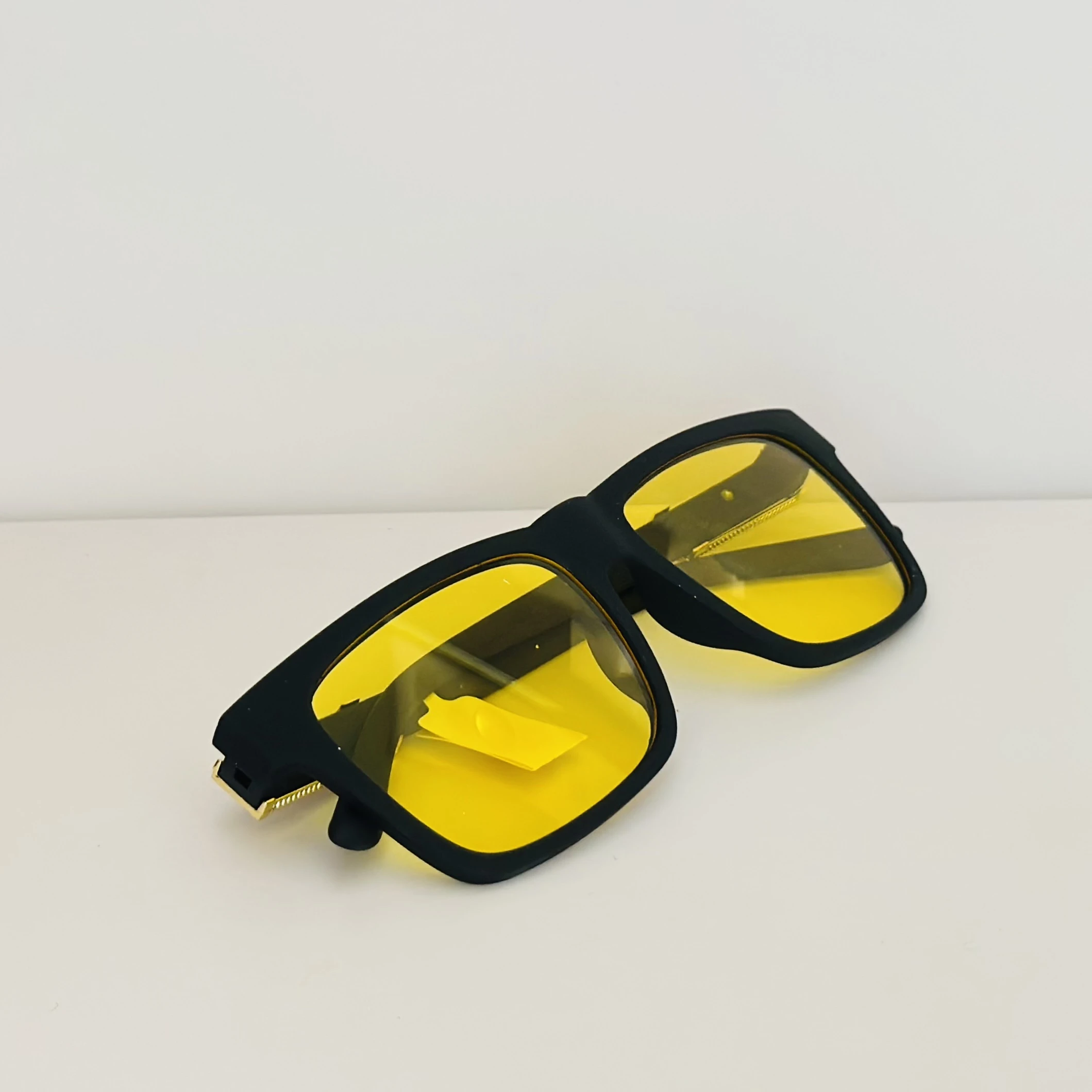 Burberry Knight BE4358 3001/85 square sunglasses in a black acetate frame with yellow lenses.