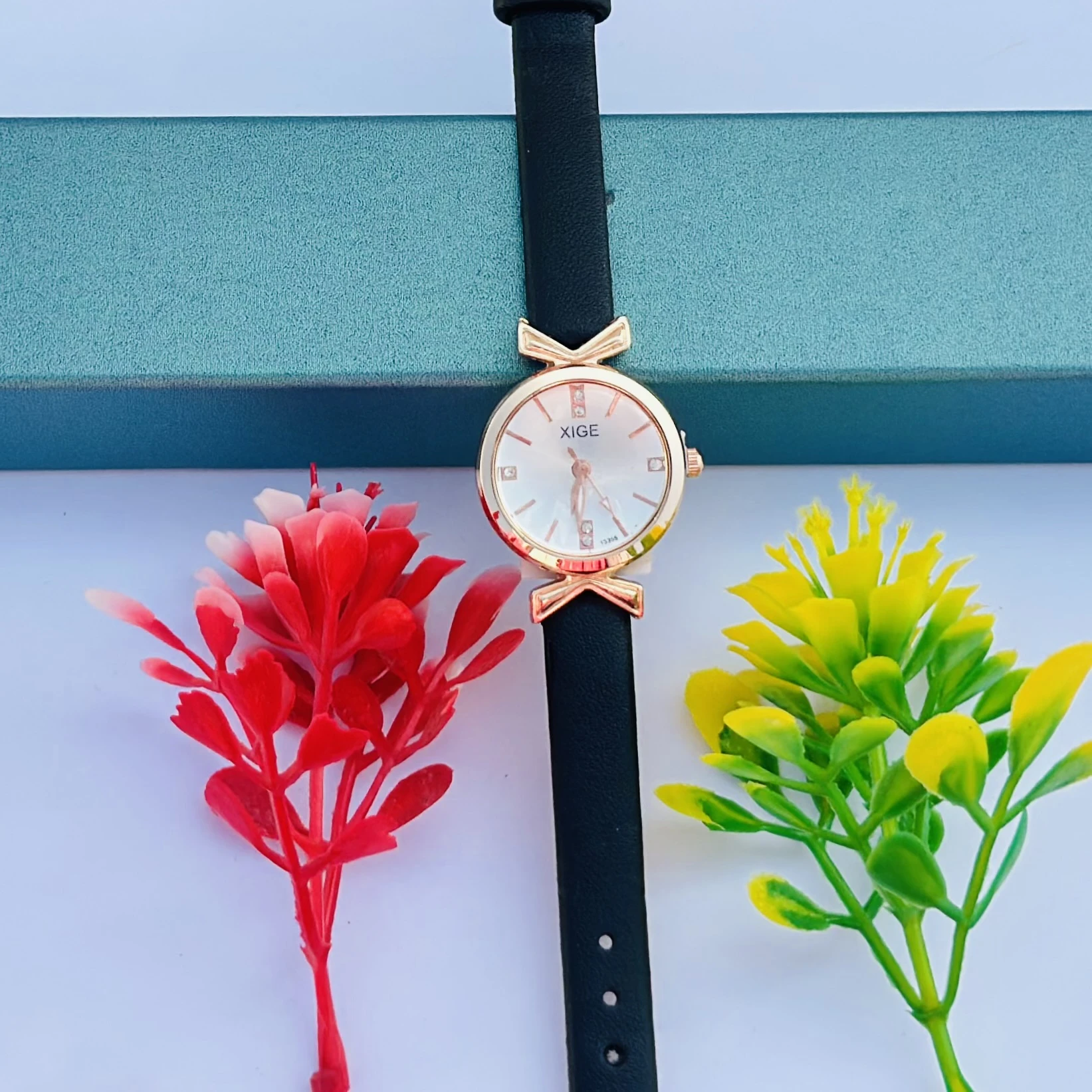 Women’s classic simple leather analog quartz wrist watch with a black strap and rose gold case.