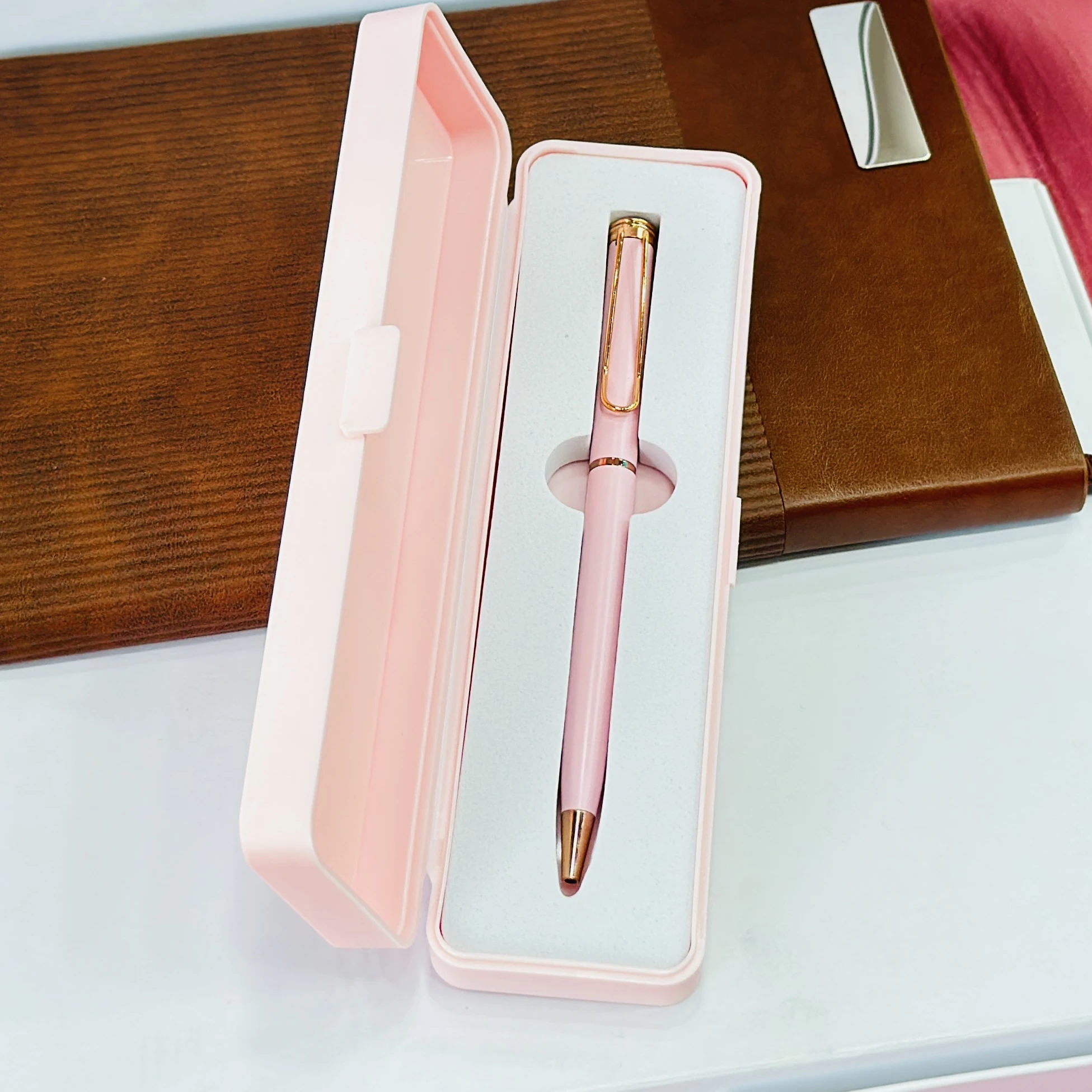 pink and rose gold ballpoint pen