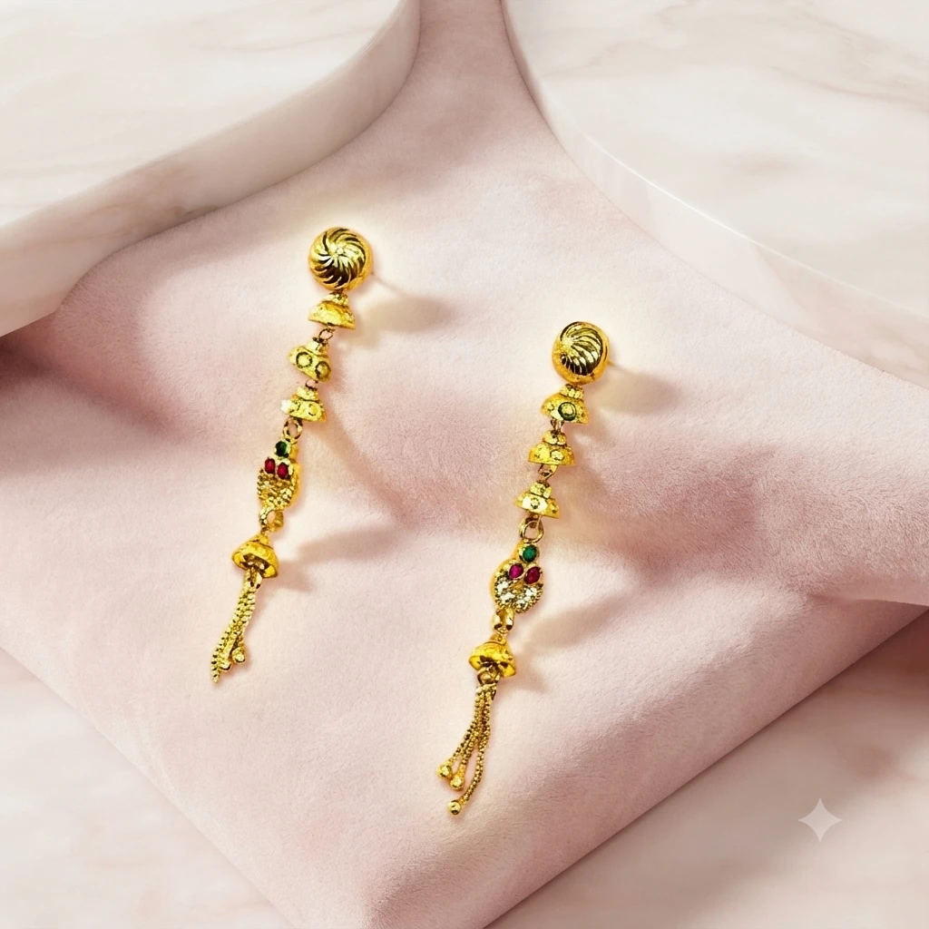 a pair of gold-plated long drop and dangle earrings