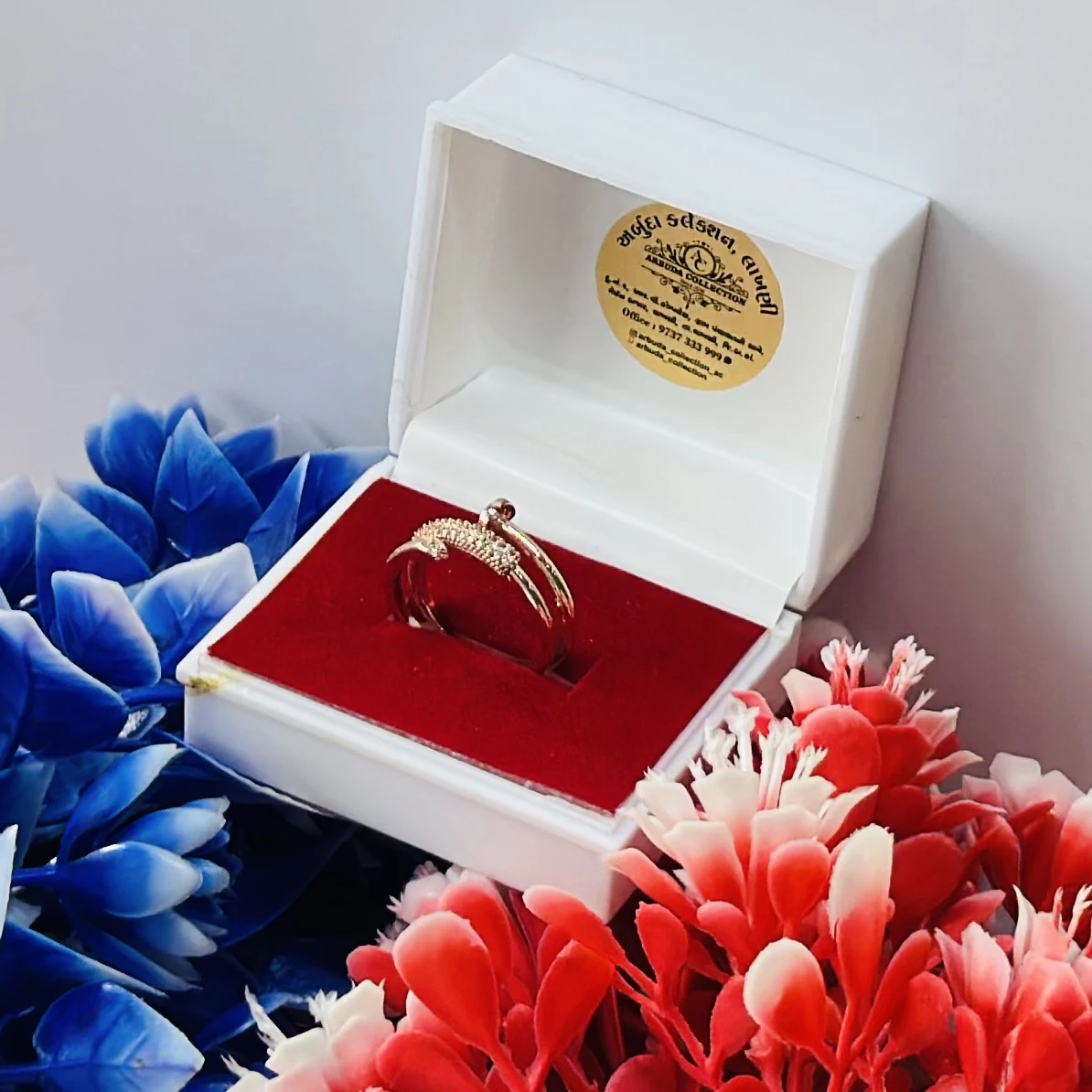 Gold and diamond snake-design ring