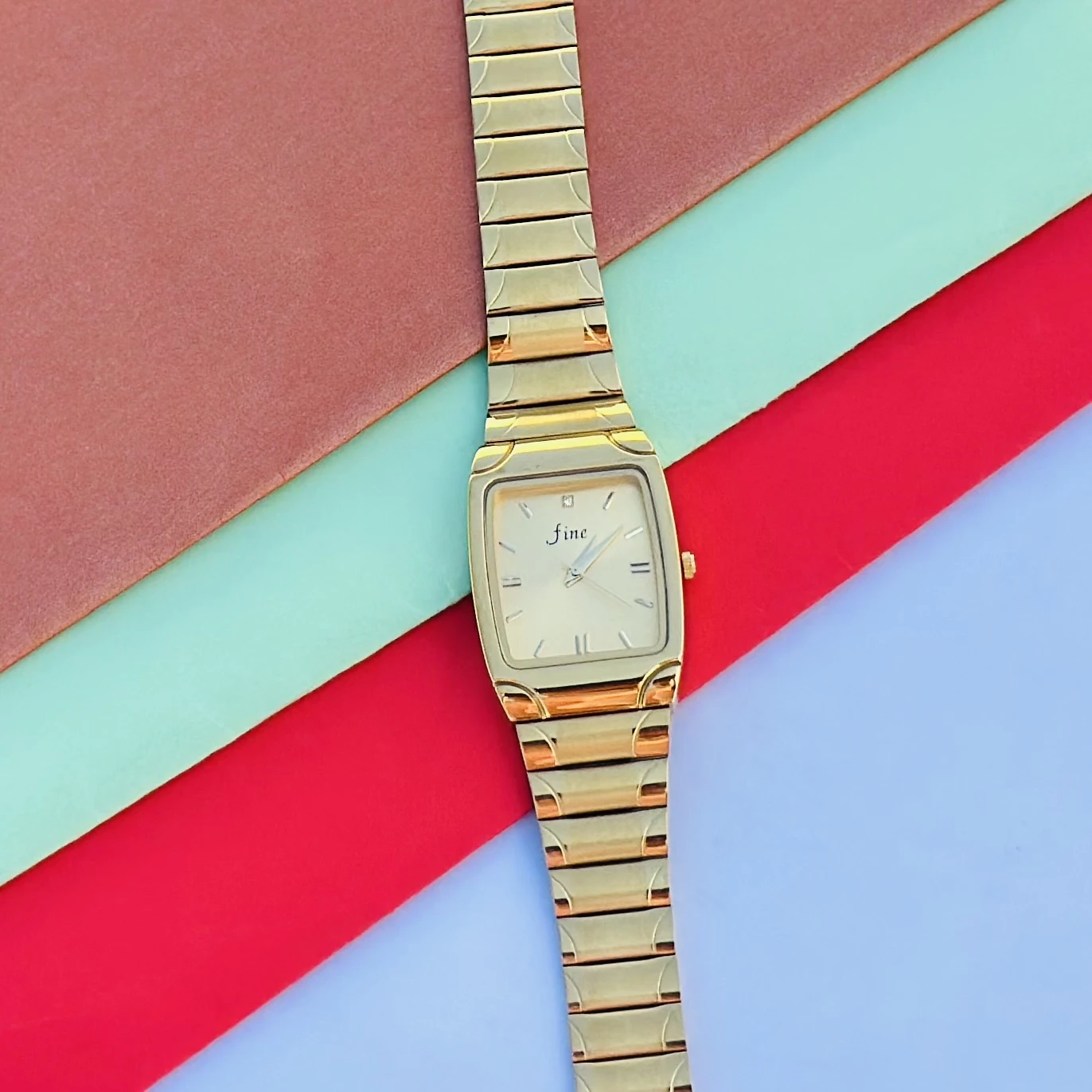 Gold tone analog wrist watch