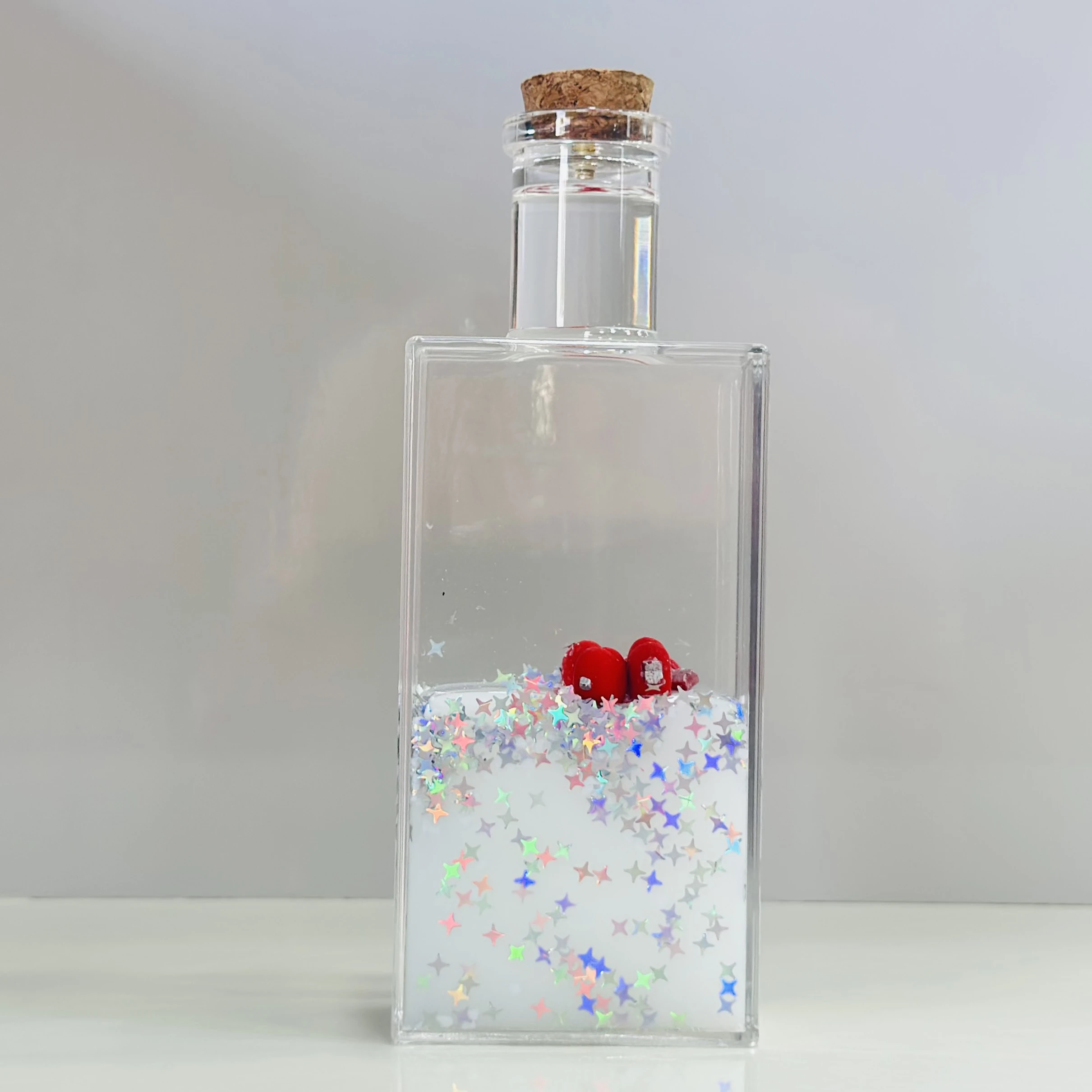 decorative fluid bottle with hearts and stars. (SKU-ATDL7R)