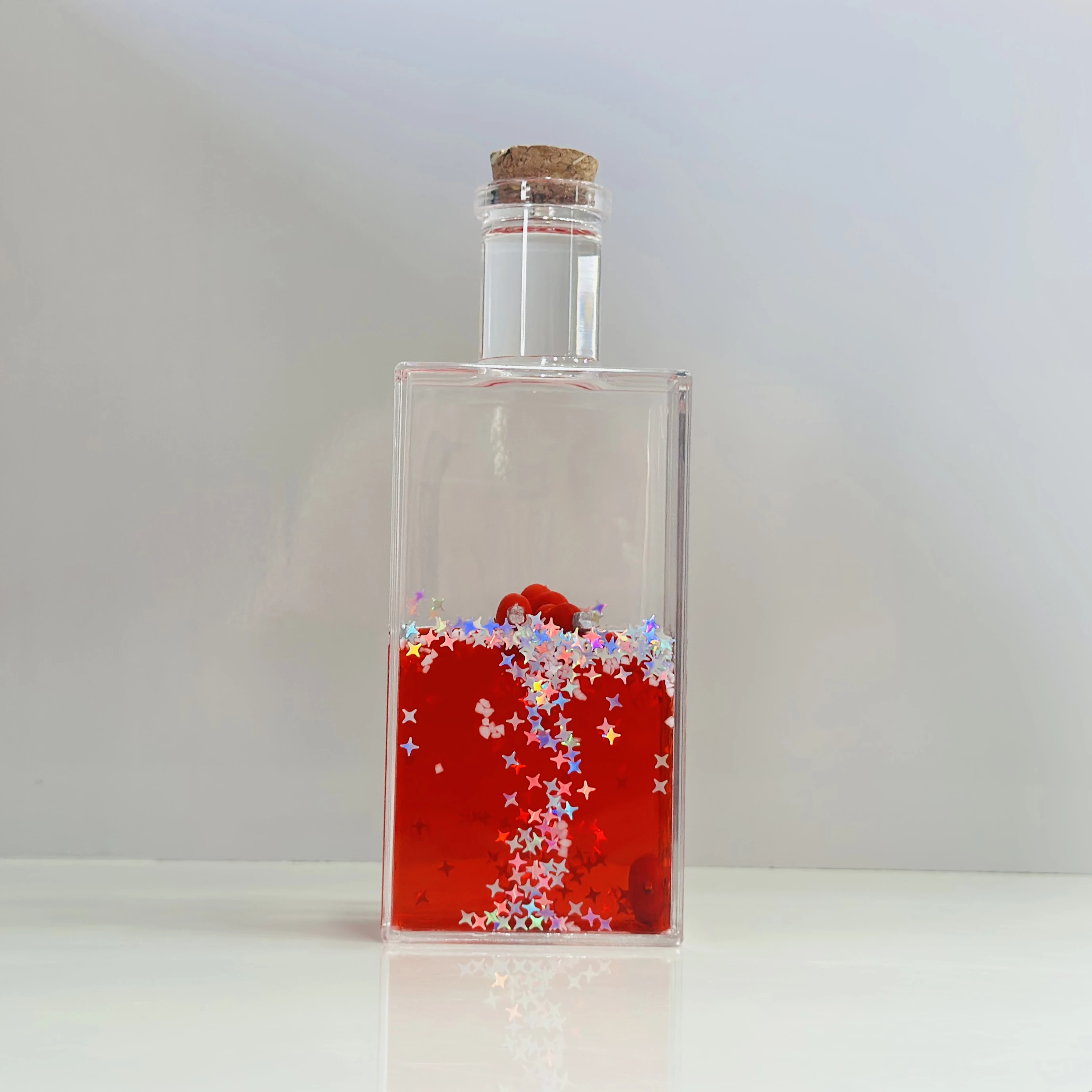 decorative fluid bottle with hearts and stars. (SKU-S4IER4)