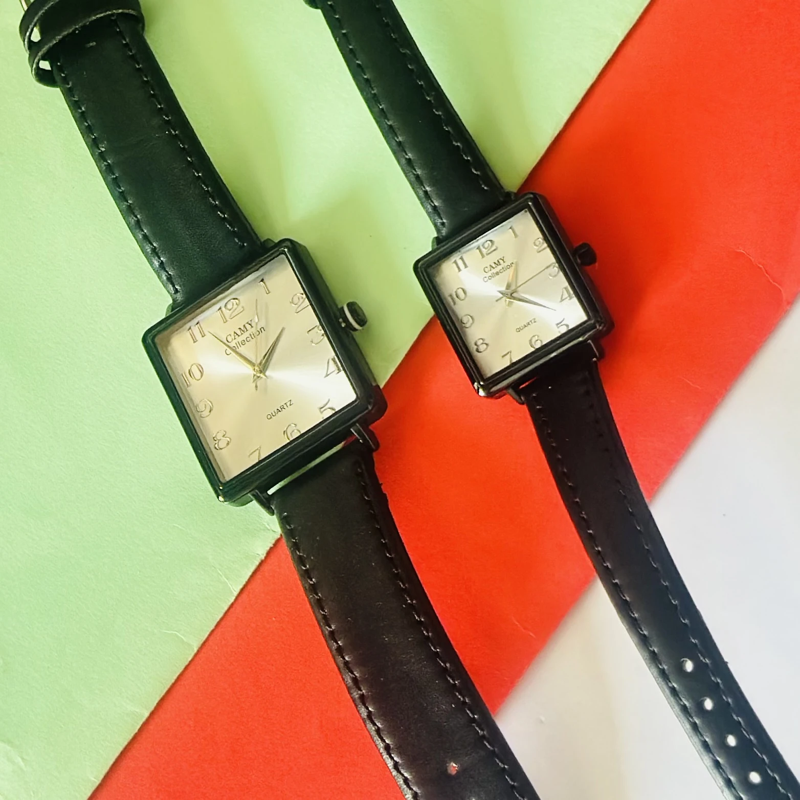 Camy Collection analog quartz watches with black leather straps and square dials.