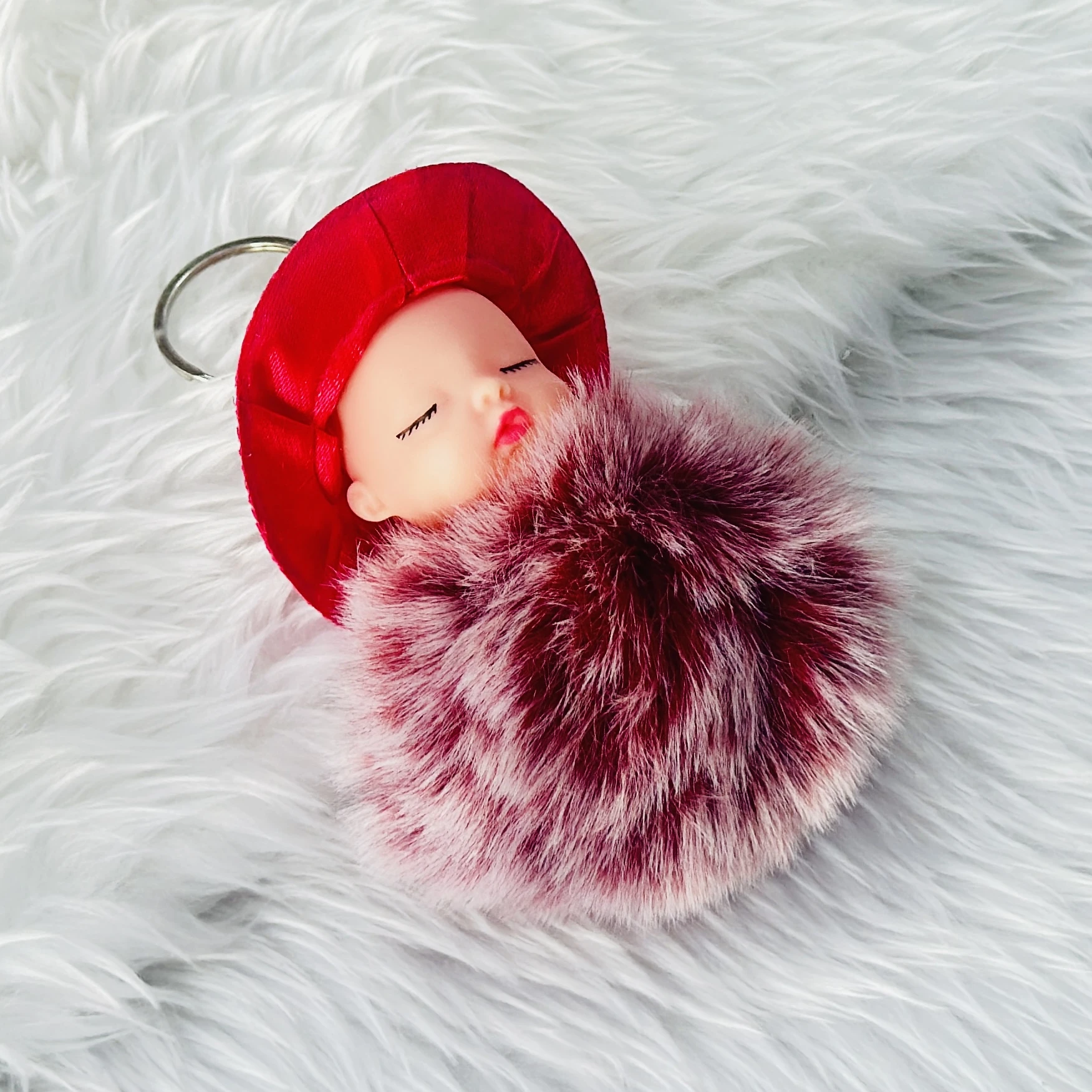 sleeping baby doll fluffy pom pom keychain