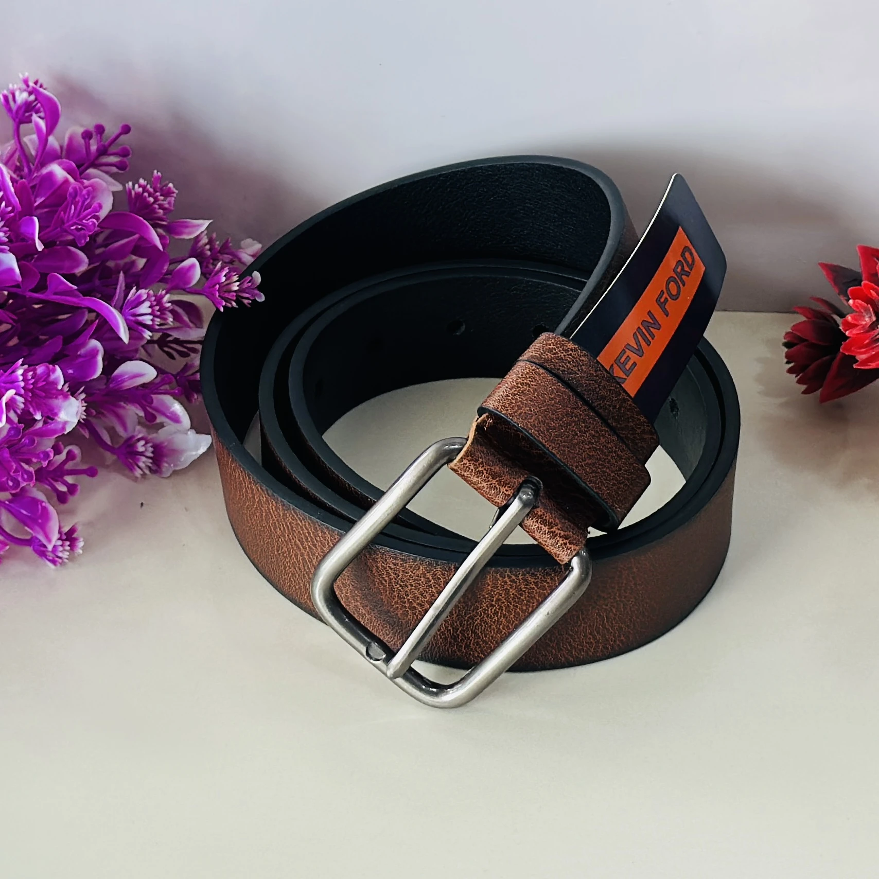 Brown leather belt by Kevin Ford