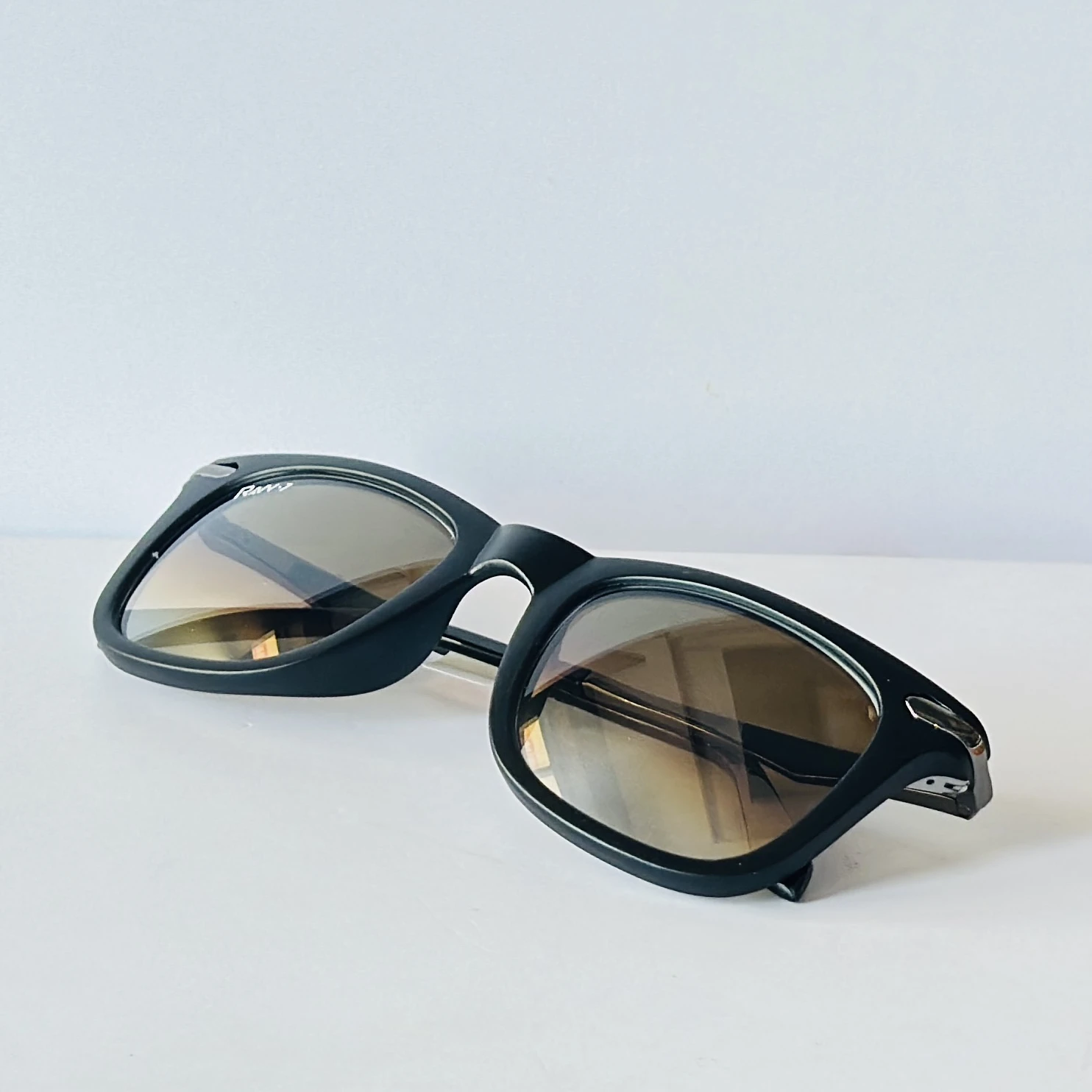 pair of Raw 7 branded men's rectangular sunglasses