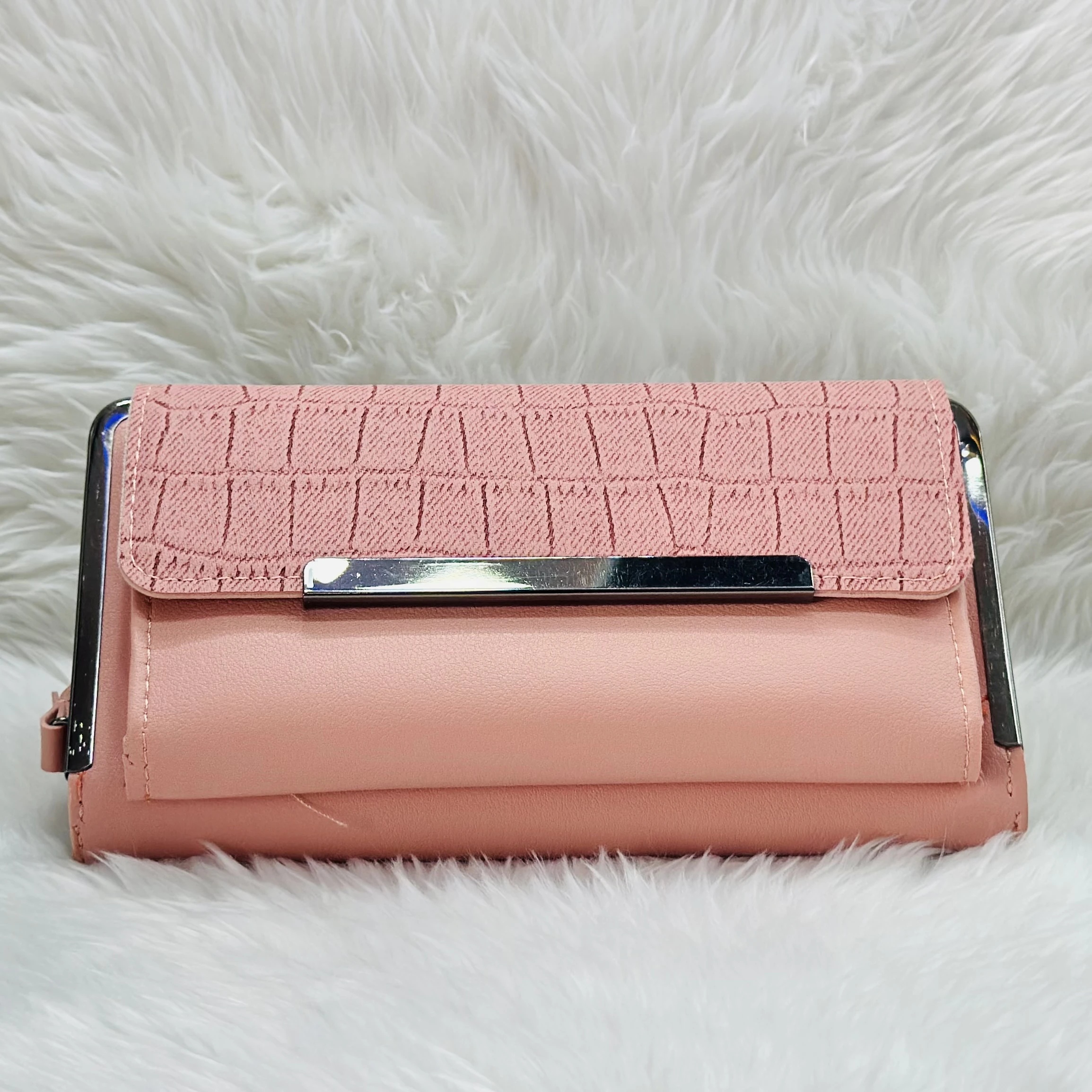 Brisfine pink clutch wallet in polyurethane outer material.