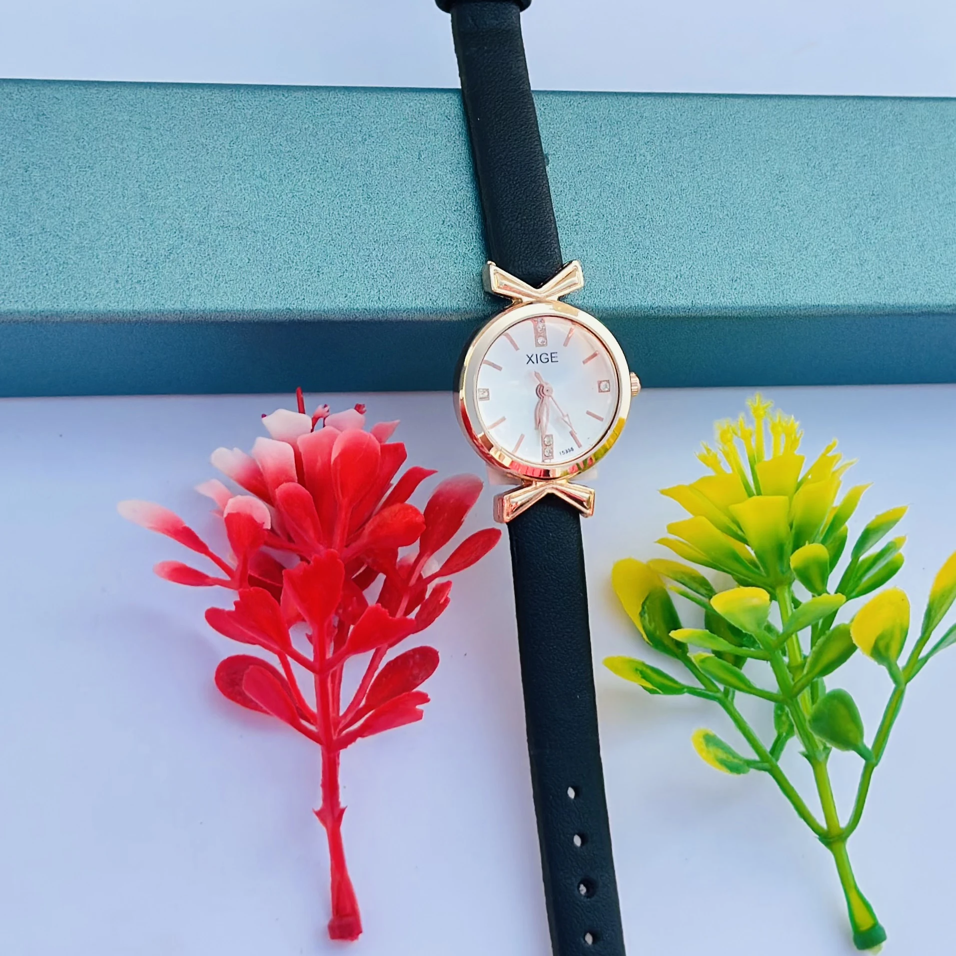 Women’s classic simple leather analog quartz wrist watch with a black strap and rose gold case.