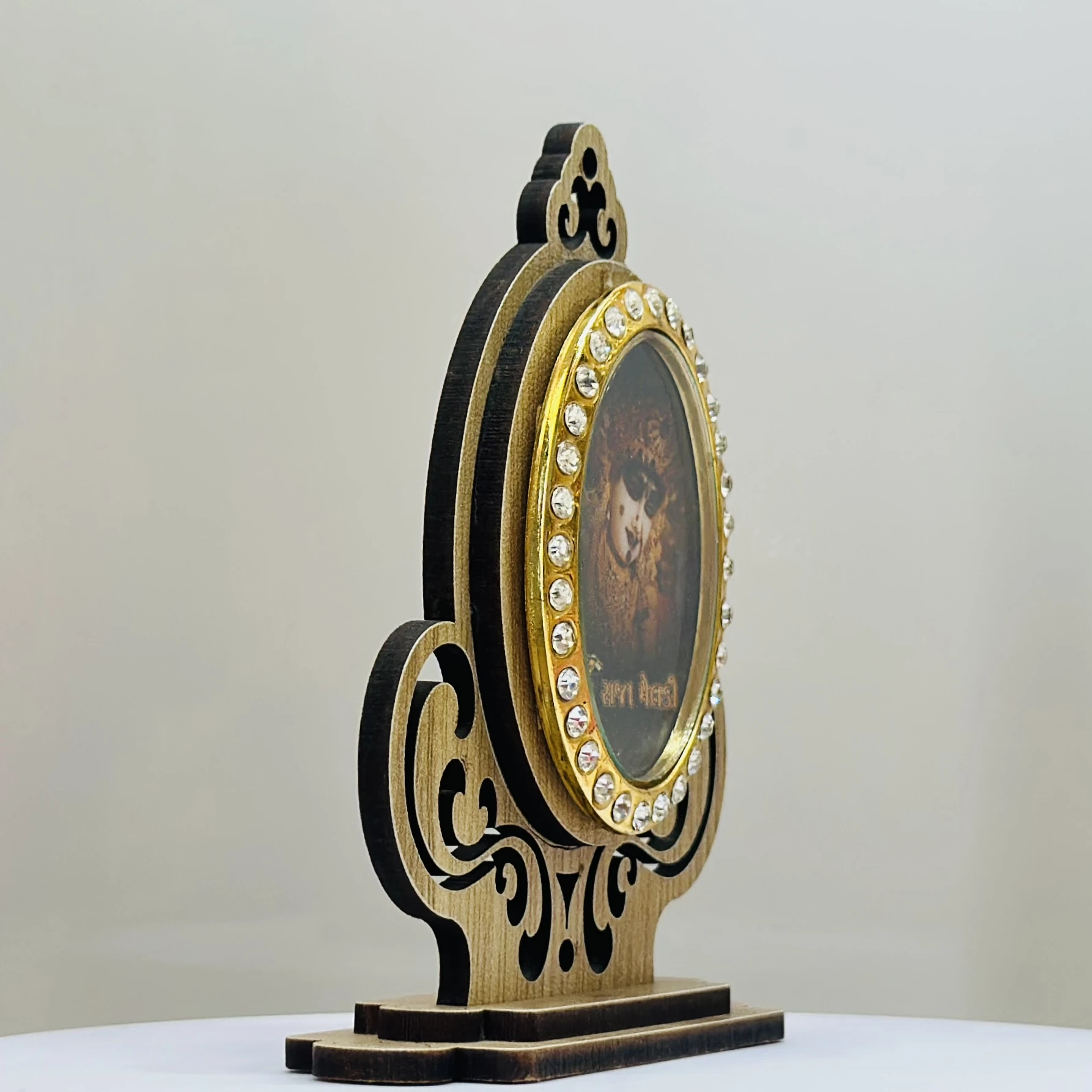 wooden showpiece featuring the Hindu deity Raja Meldi