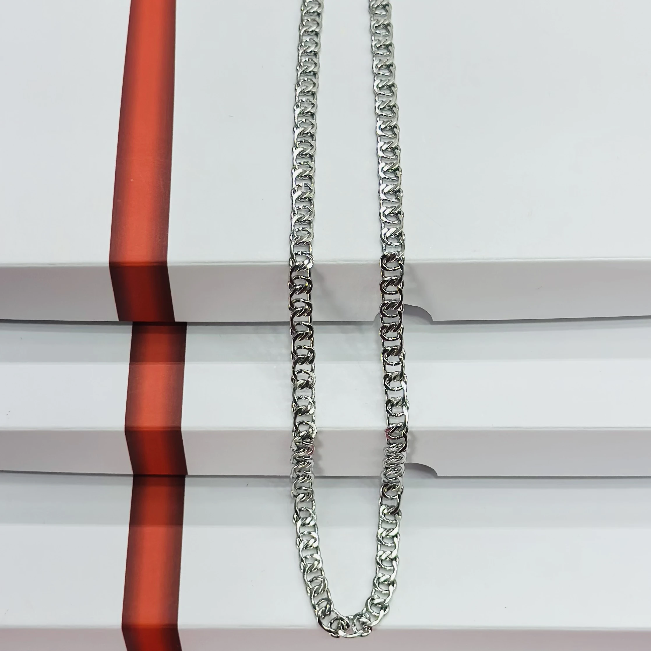 Silver toned metal curb chain
