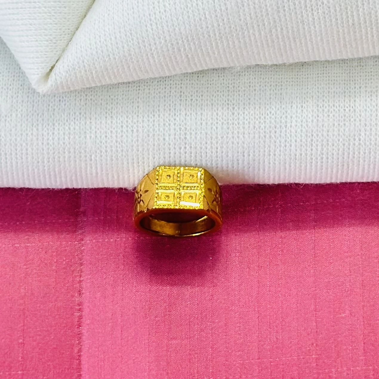 Gold ring for men with a matte finish and detailed square design.