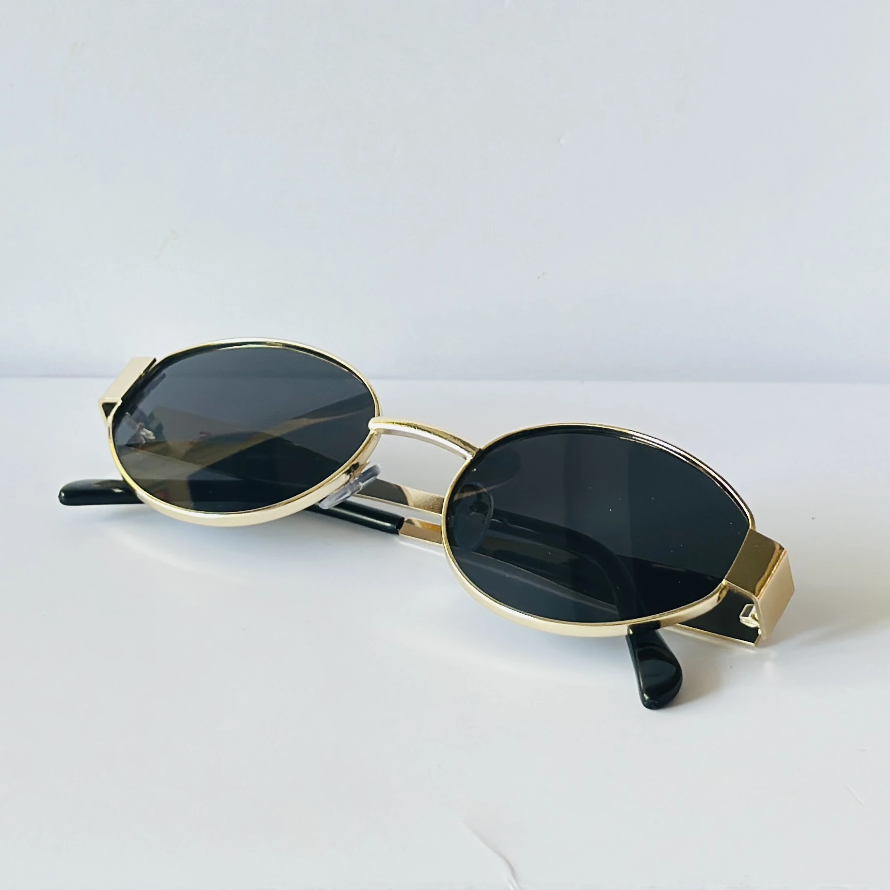 classic gold-framed oval sunglasses