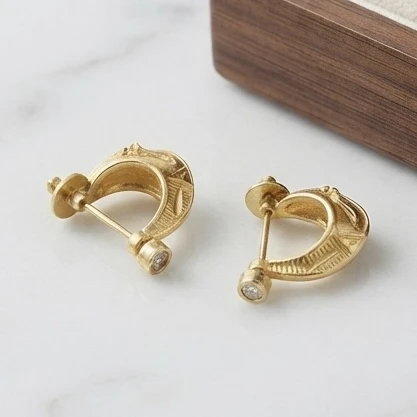 Zivika gold-plated textured hoop earring
