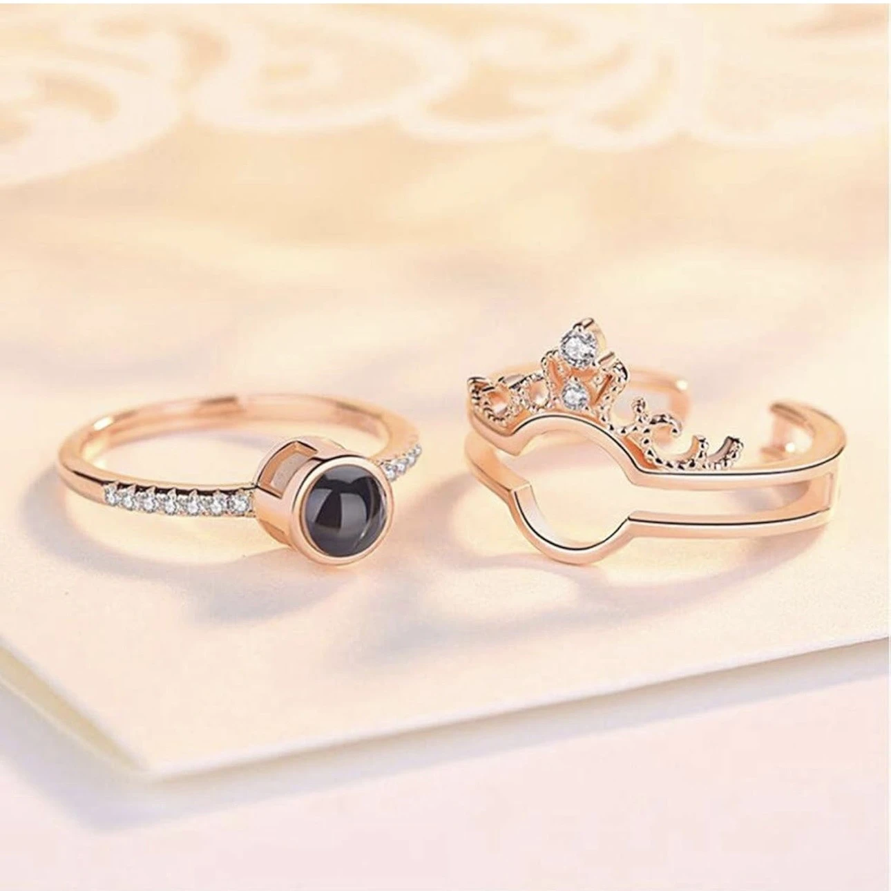 crown-design "I Love You" in 100 languages projection ring, often made from a zinc alloy or artificial material.