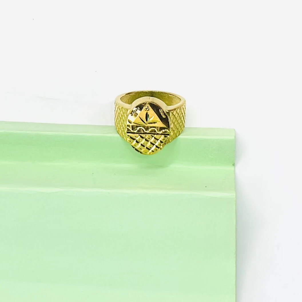 Gold plated men's ring with a cross design.