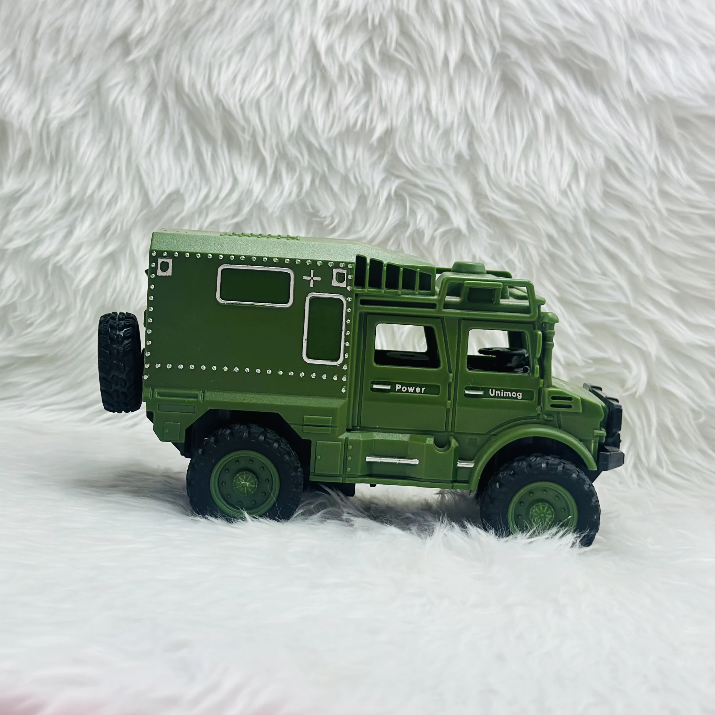 Toy Club Unimog army truck toy.
