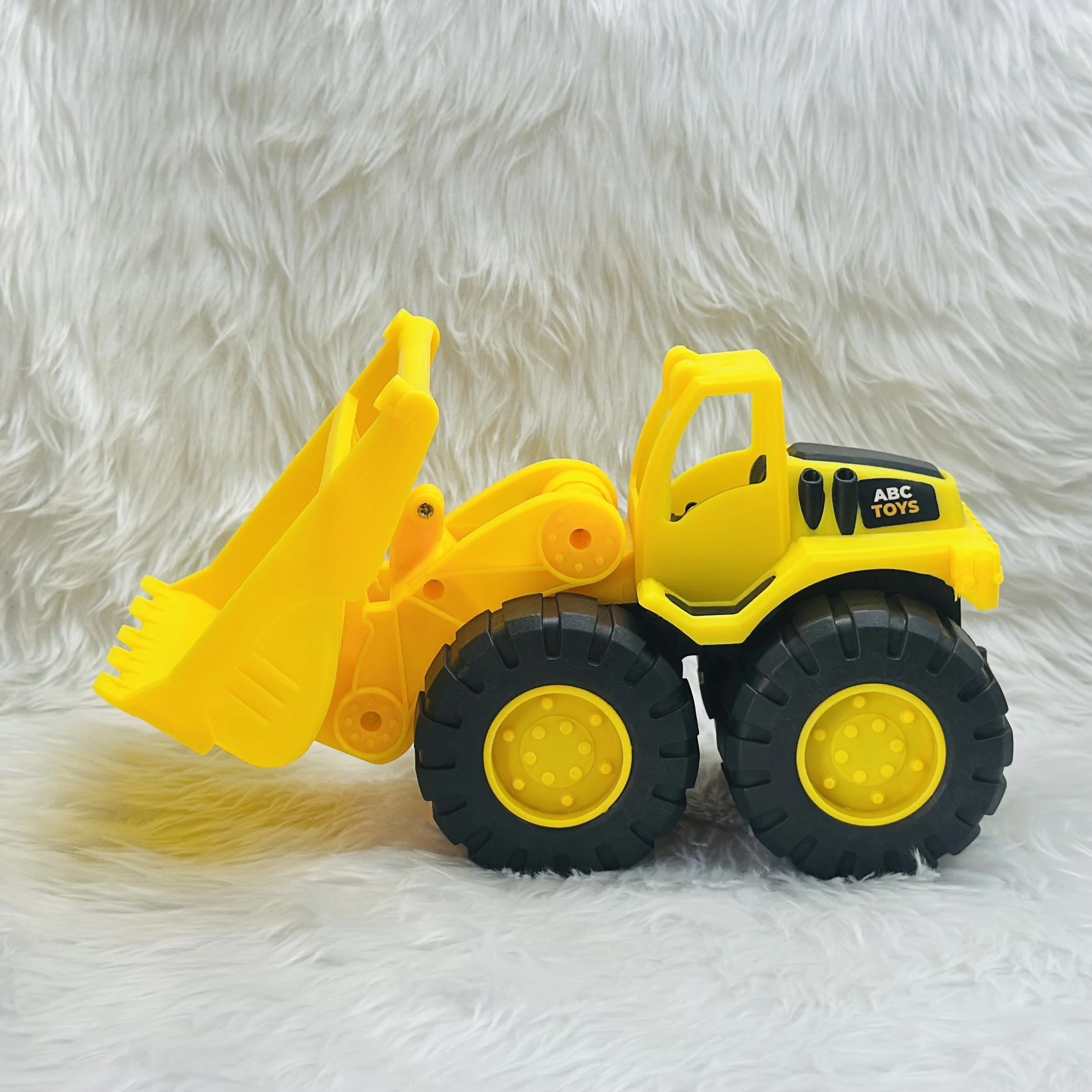 Yellow toy wheel loader,