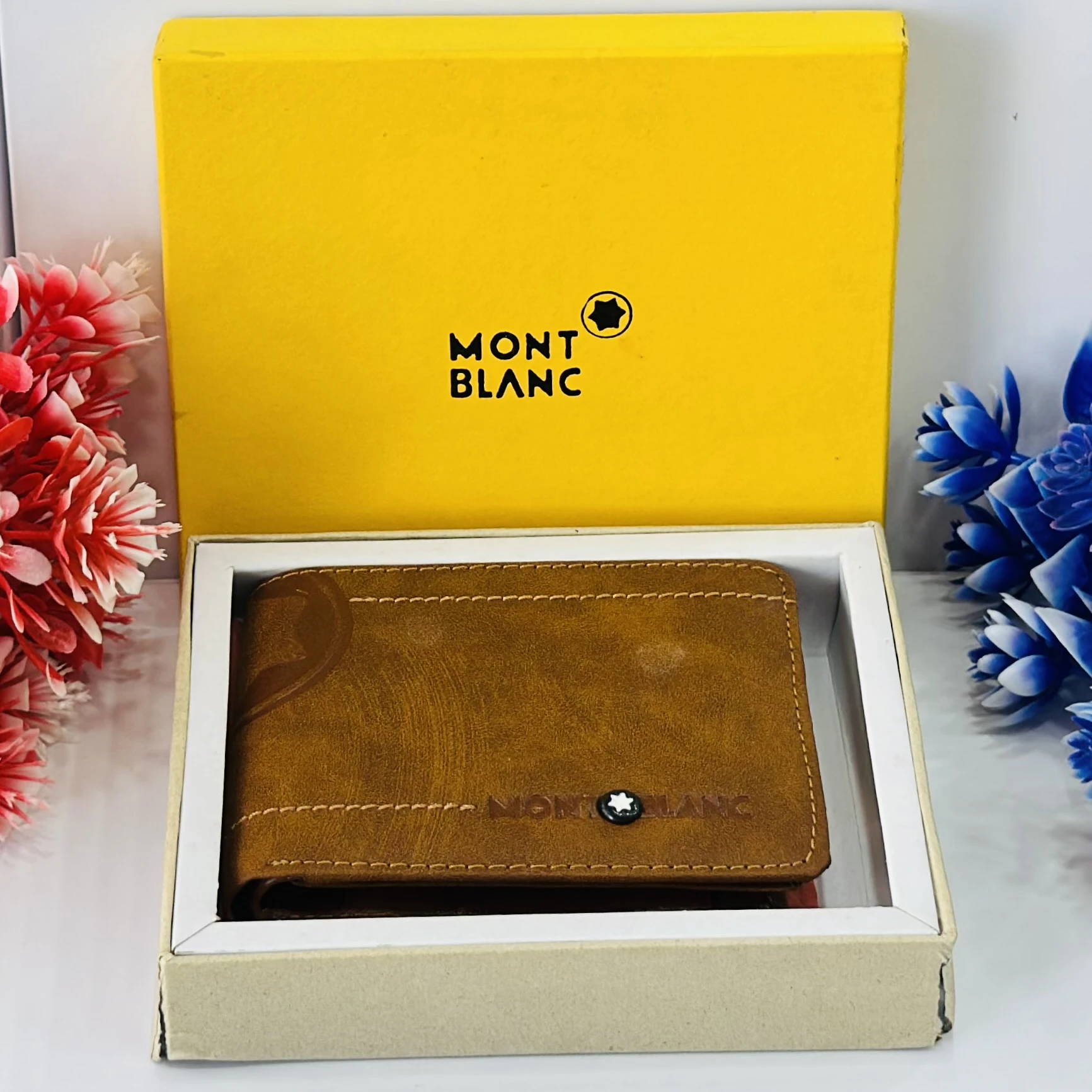 Brown bifold leather wallet in a Montblanc gift box.