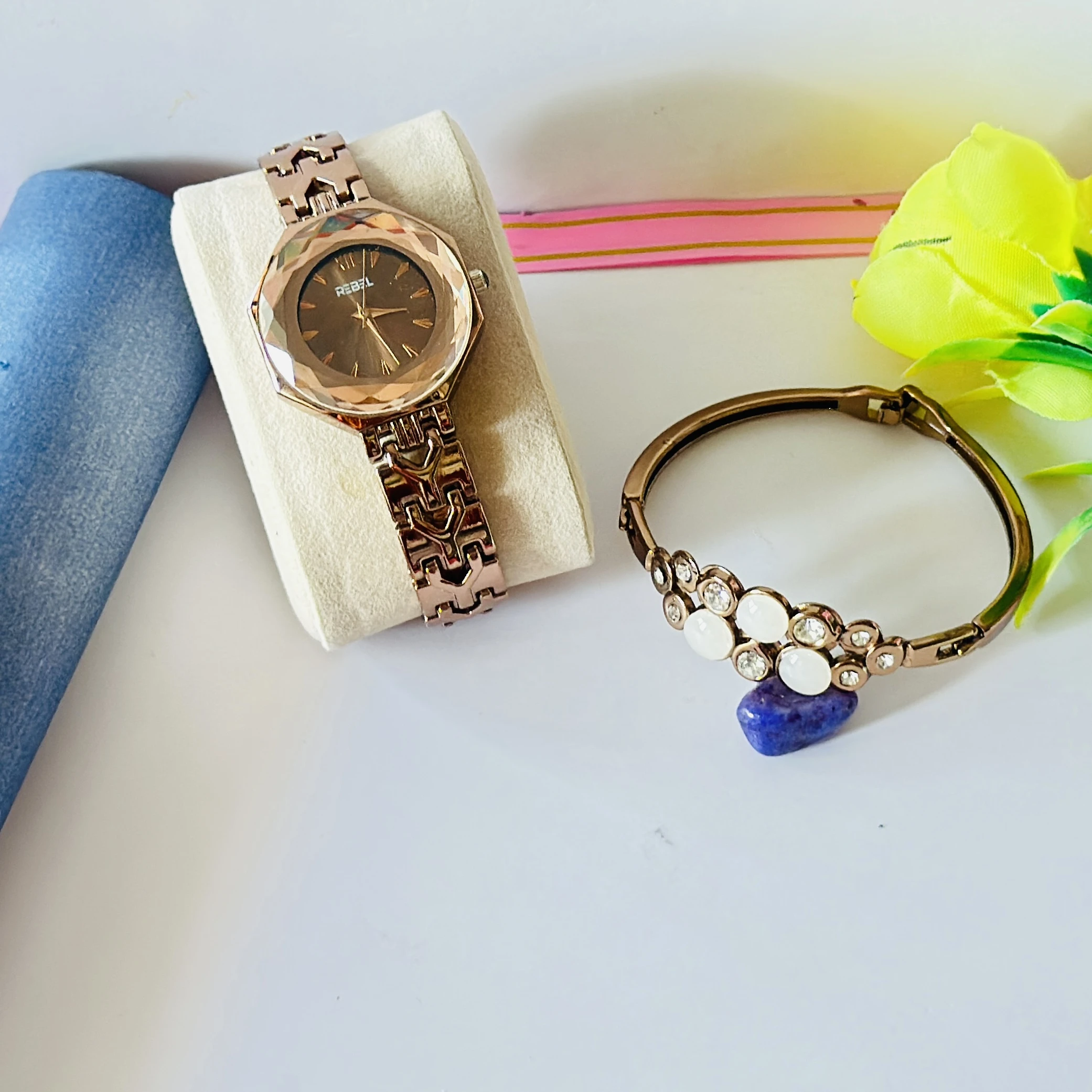 women's analog watch and a bracelet in rose gold tone