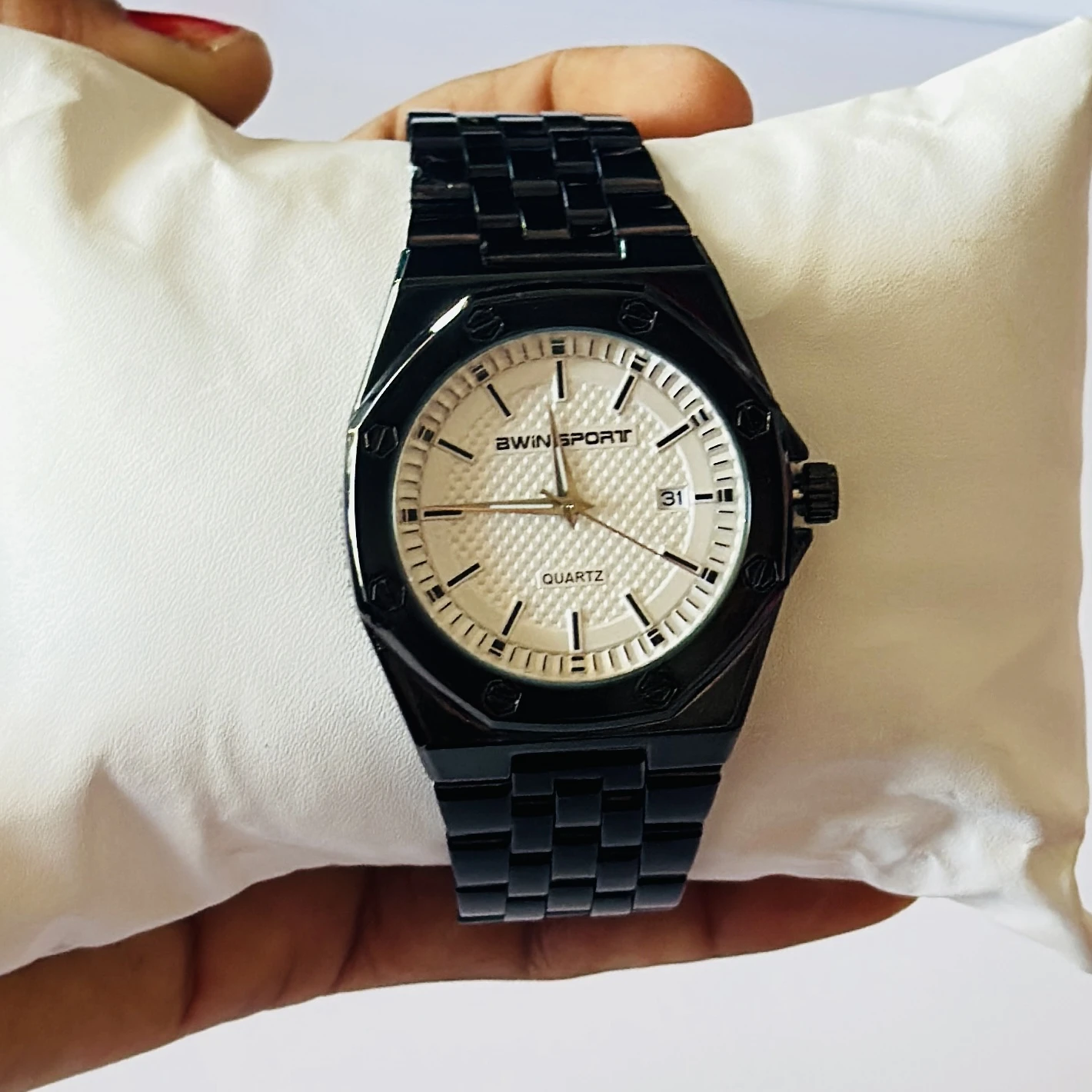 watch is a men's quartz timepiece