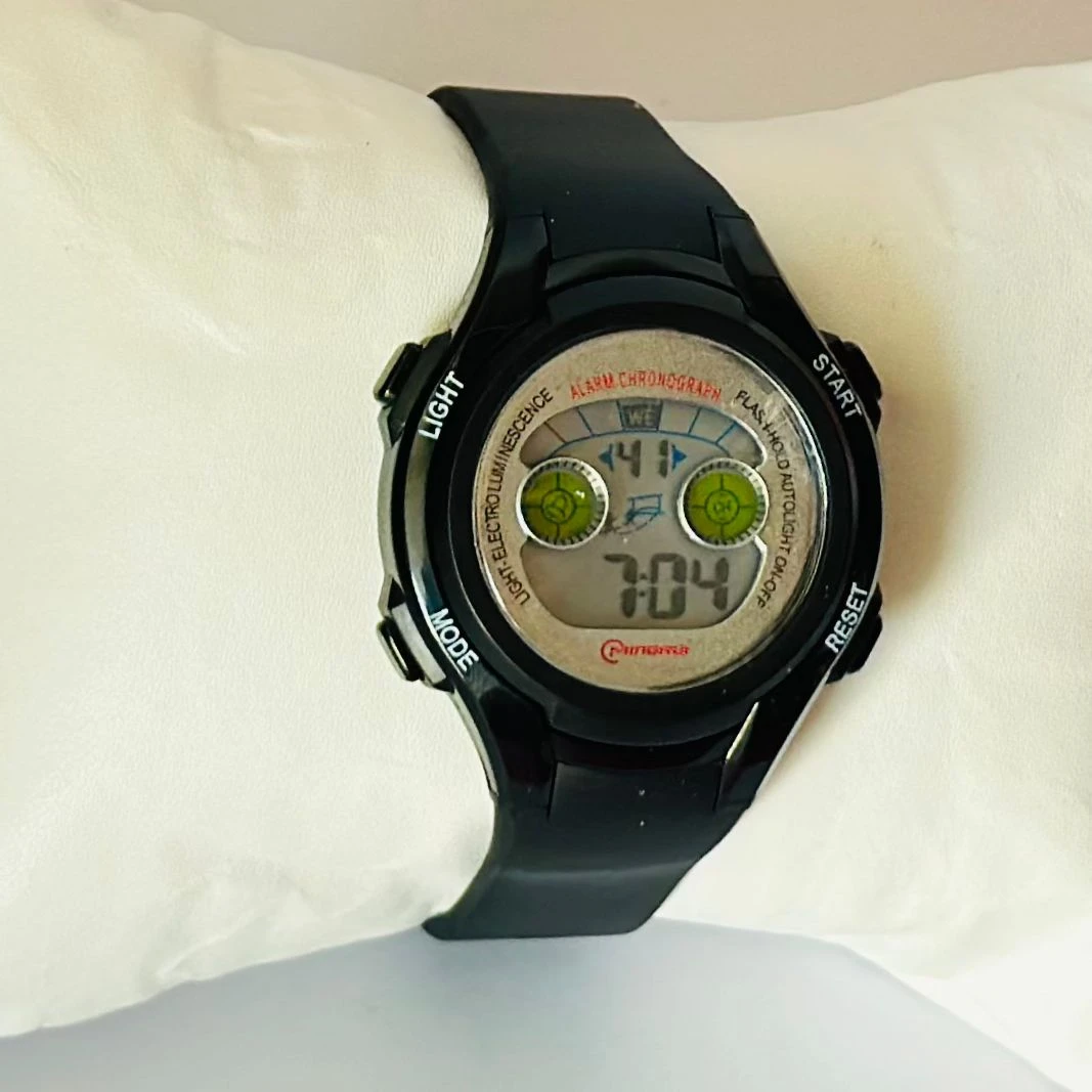 black Mingrui digital sports watch with a plastic or rubber strap.