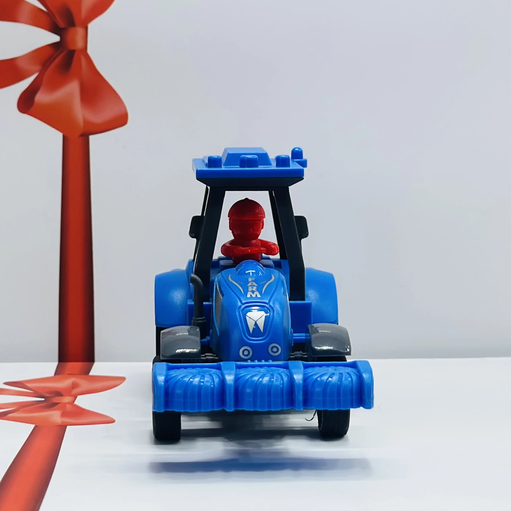 Blue plastic toy tractor