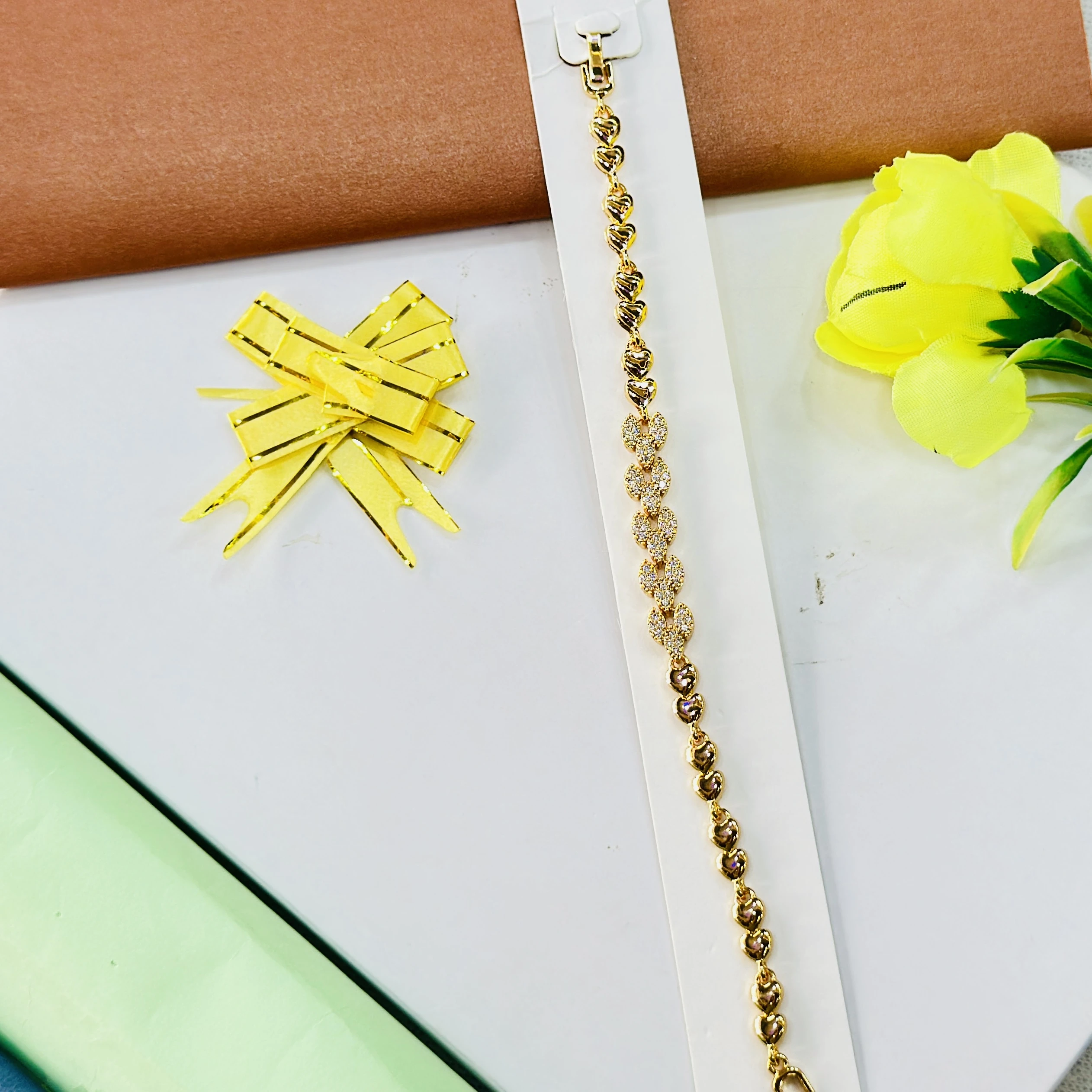 Gold plated bracelet with a heart and crystal design