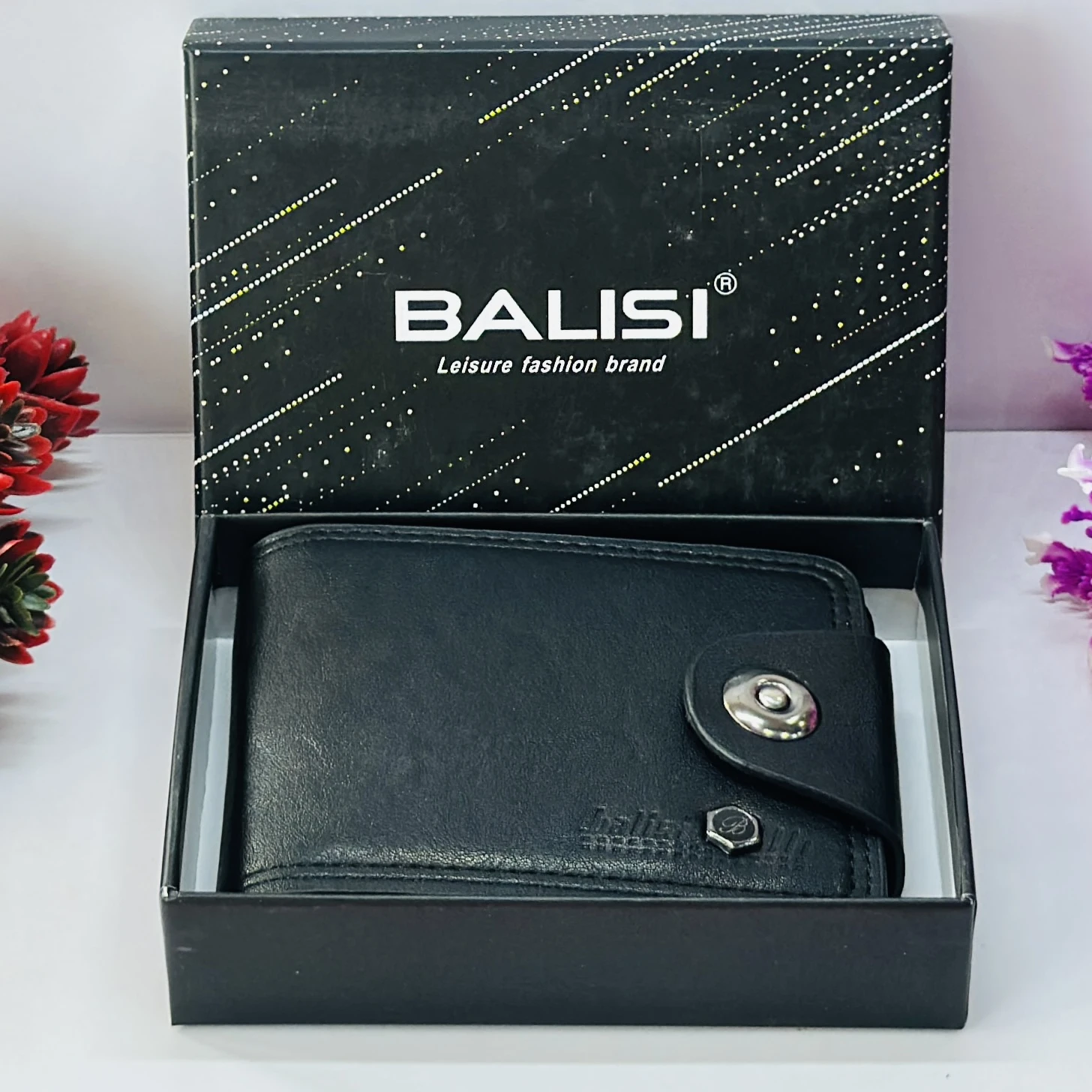 Black leather bi-fold wallet with a button closure.