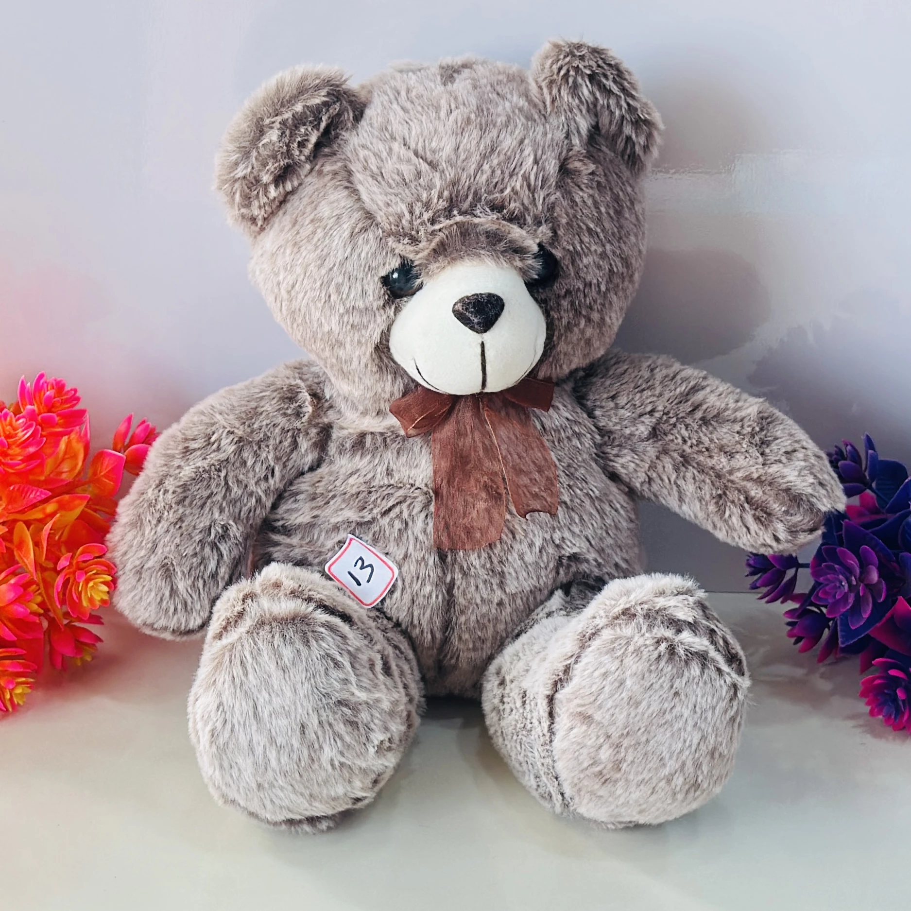 Light grey plush teddy bear