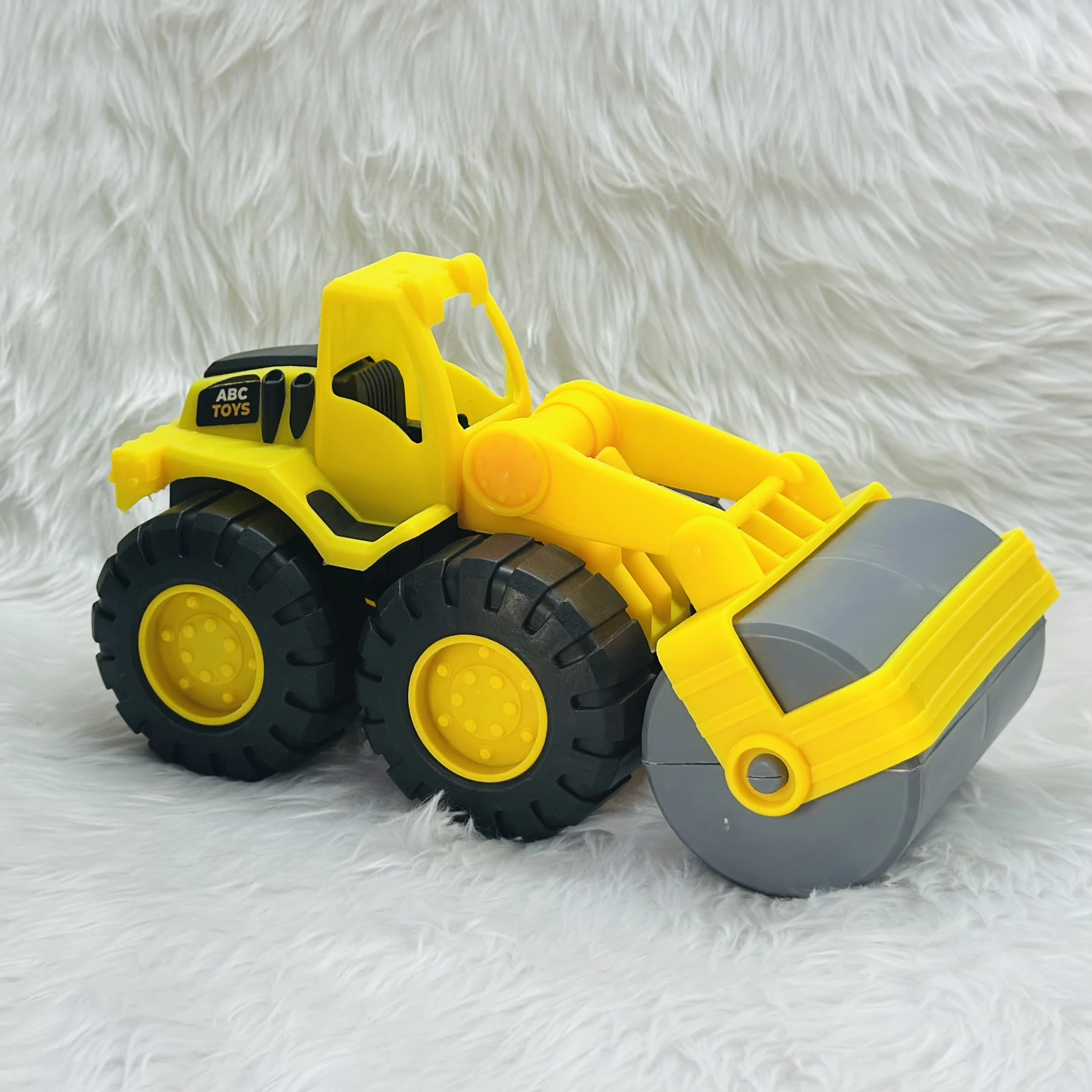 Yellow ABC Toys plastic road roller toy.