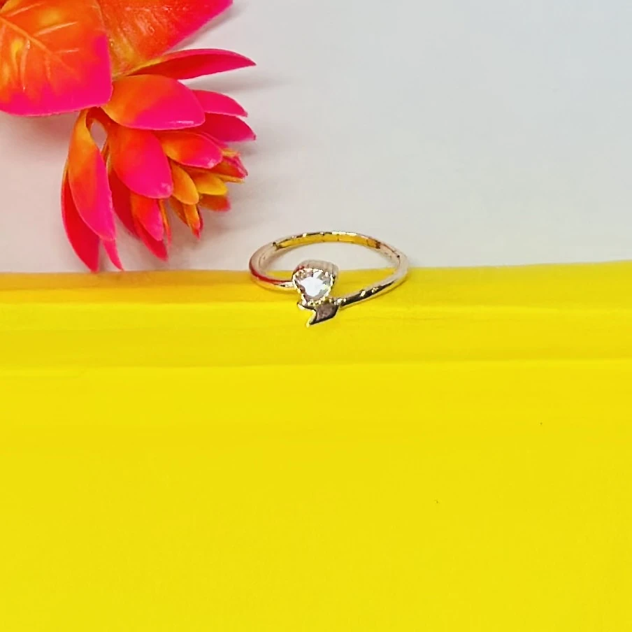 Gold plated ring with a heart-shaped stone.