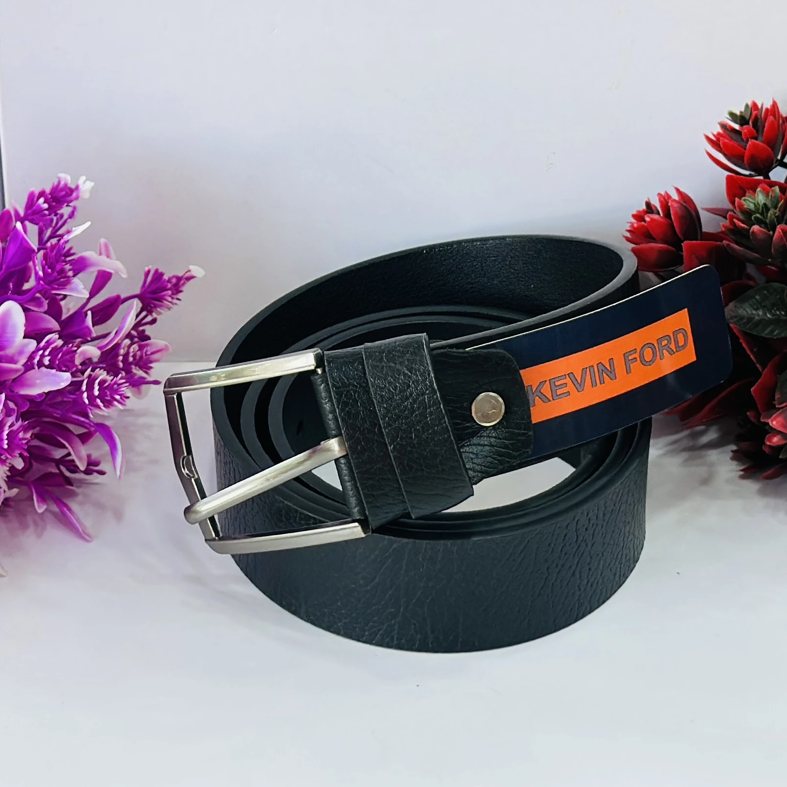 Black leather belt with a metal buckle.