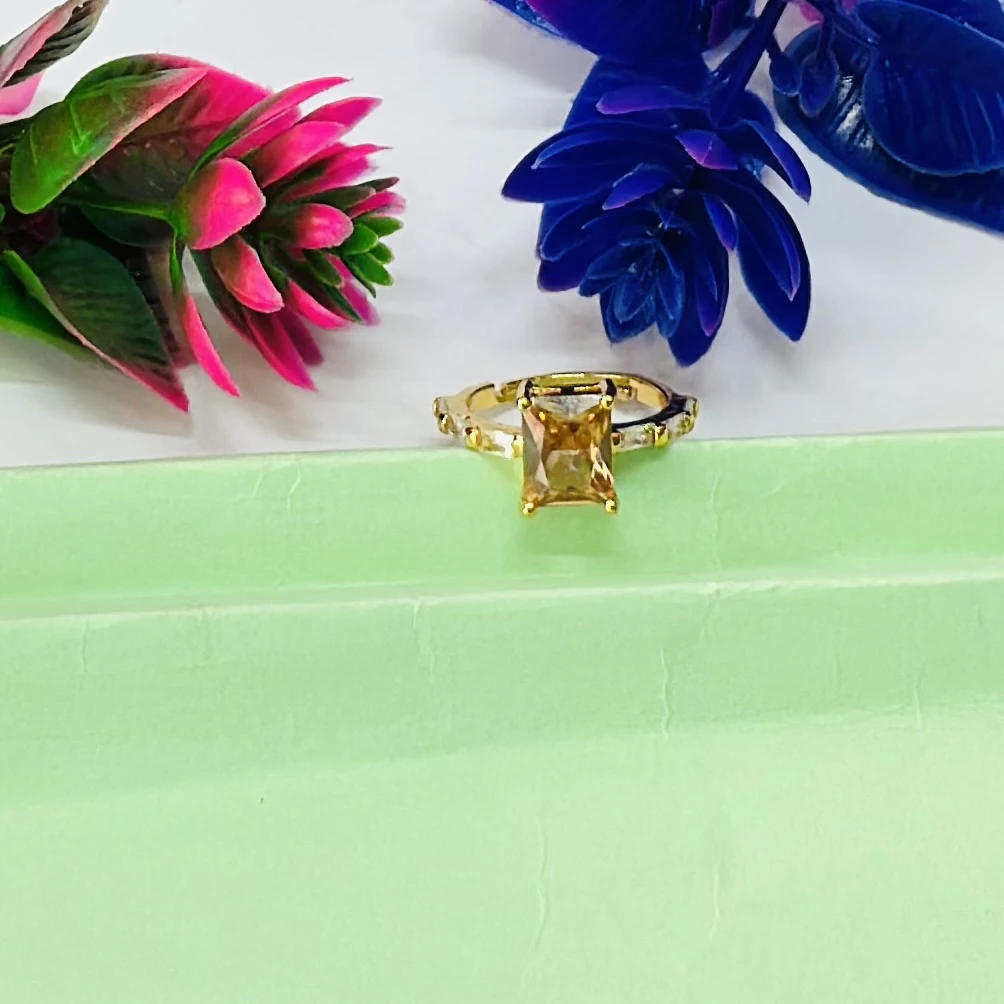 Gold plated ring with a yellow gemstone